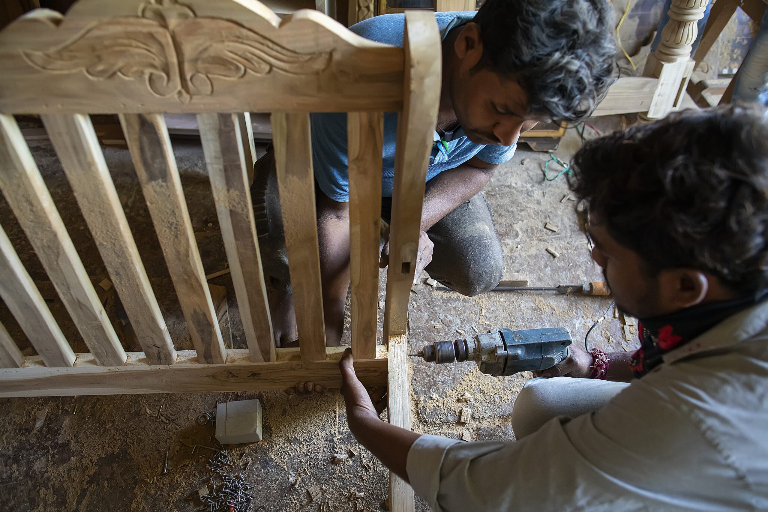 Carpenters working on a wooden design