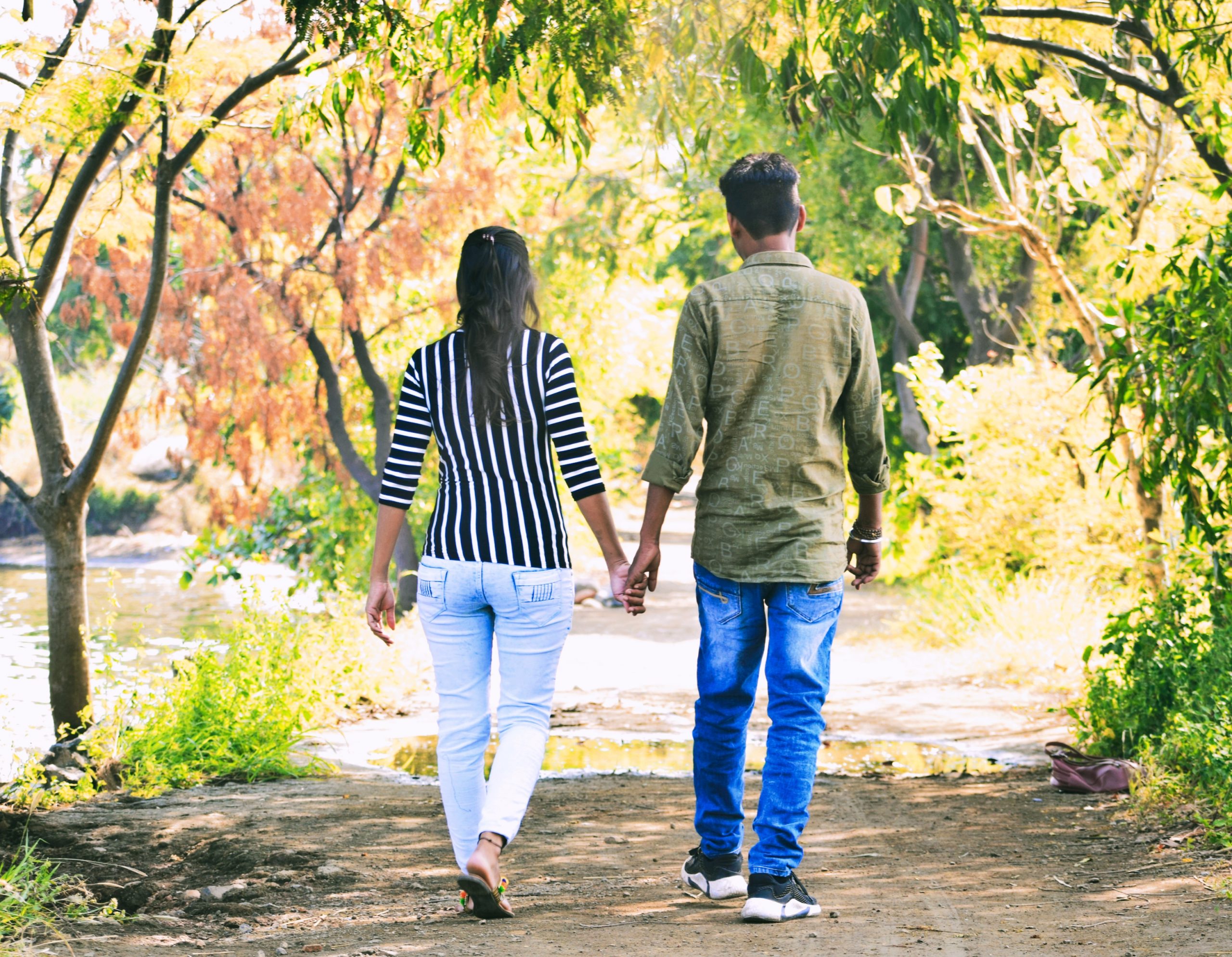 couple walking in garden path