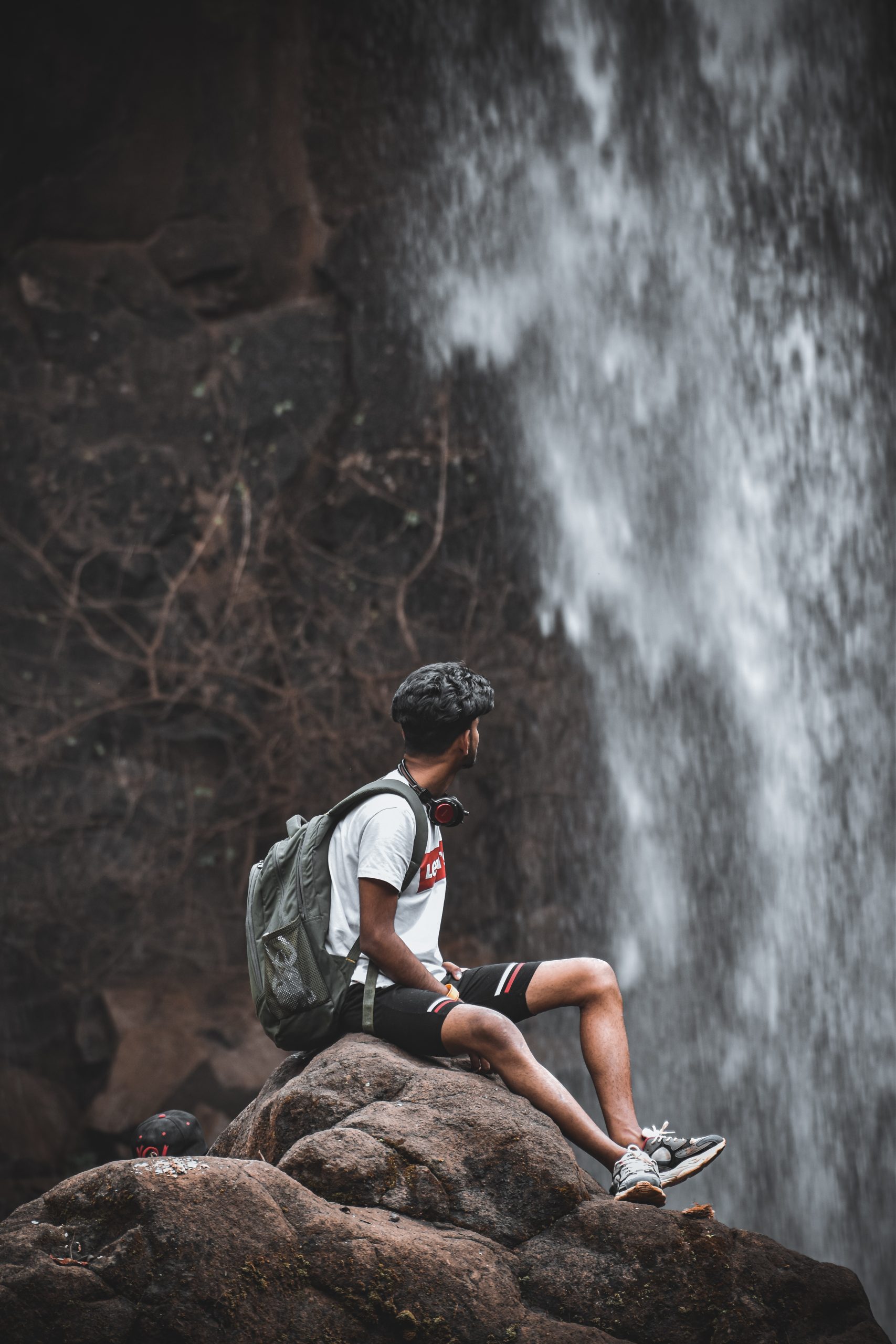 Man admiring waterfall