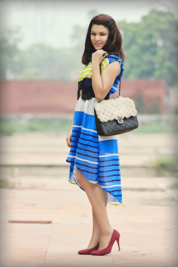 Girl posing with handbag PixaHive