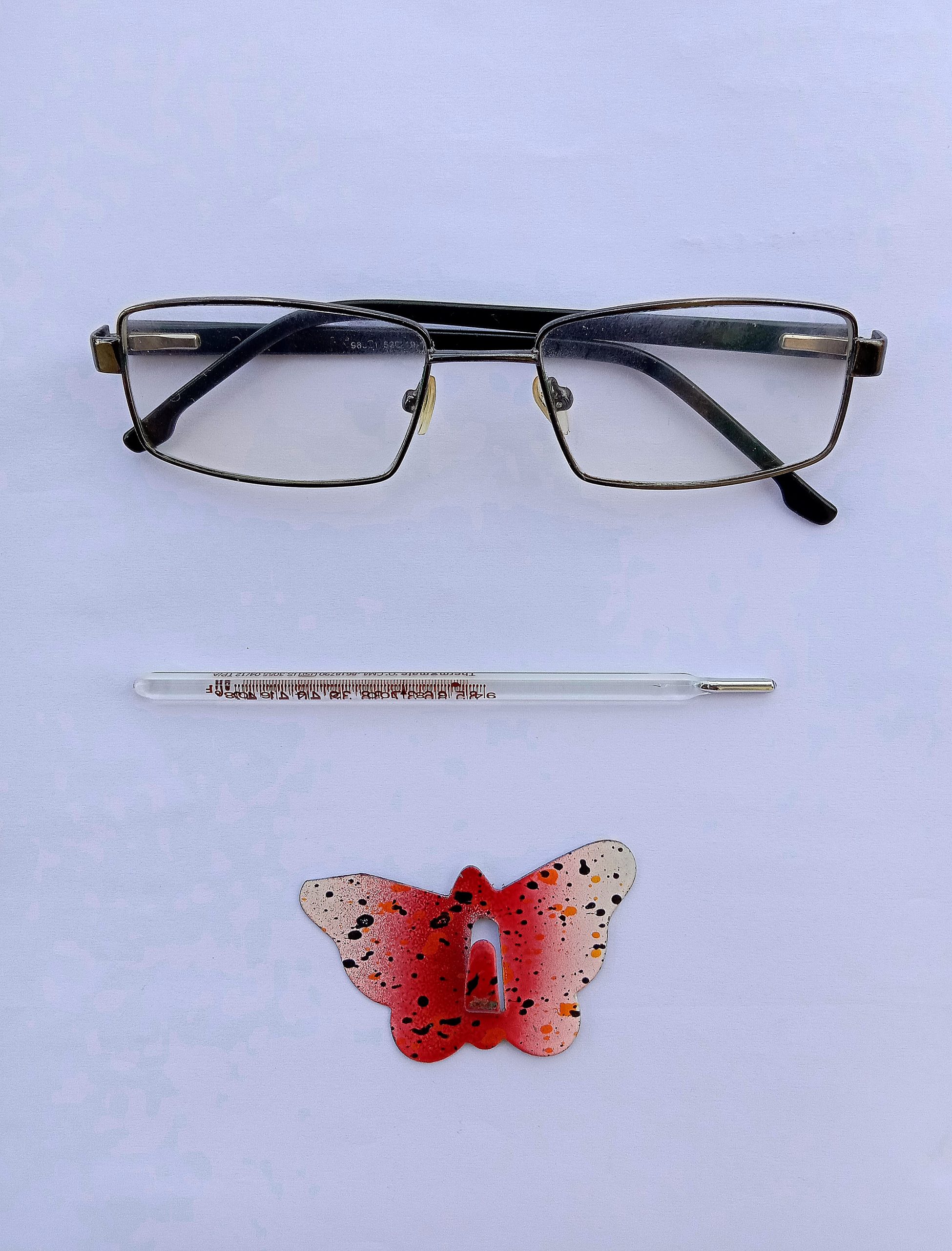 spectacles, thermometer, hook