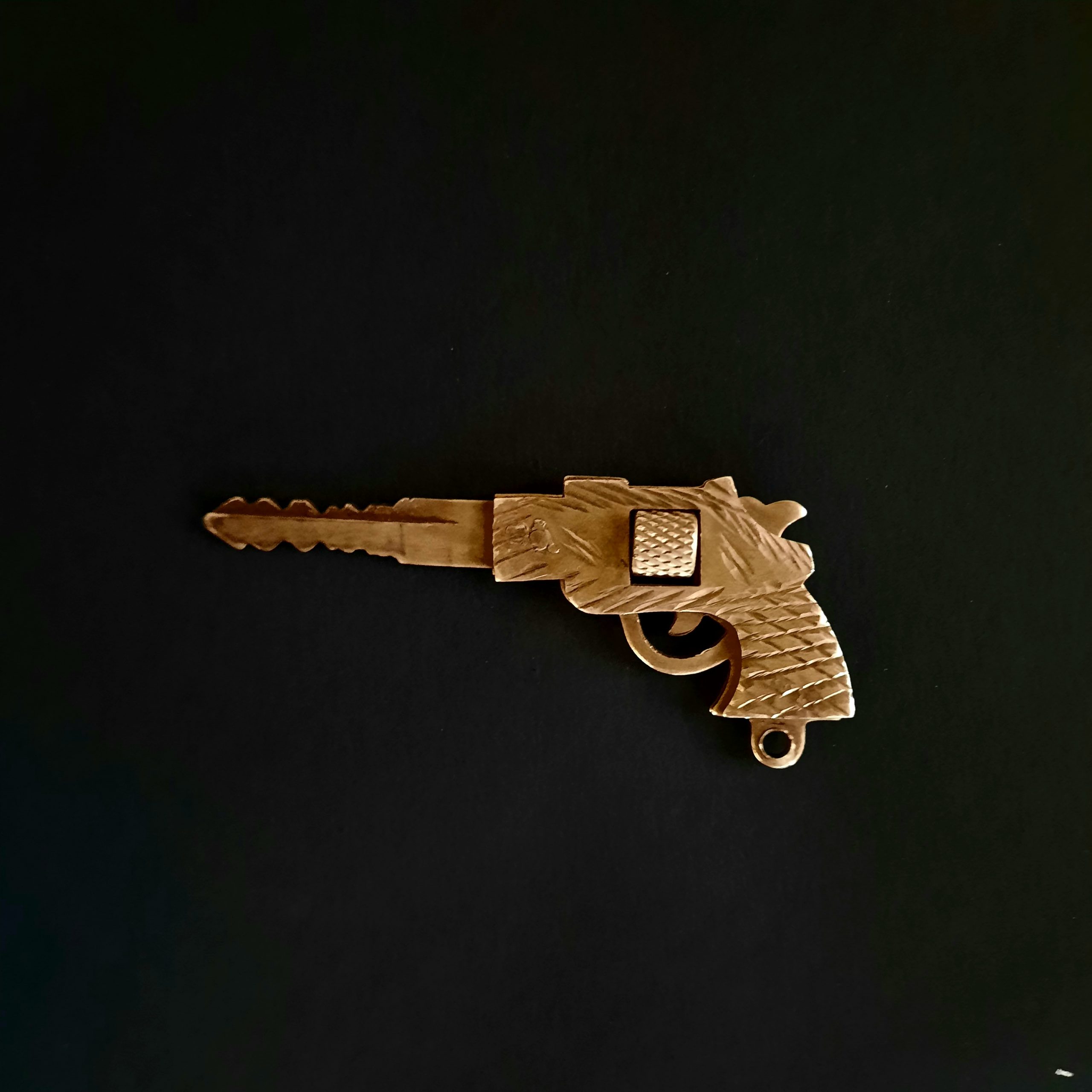key in the shape of gun