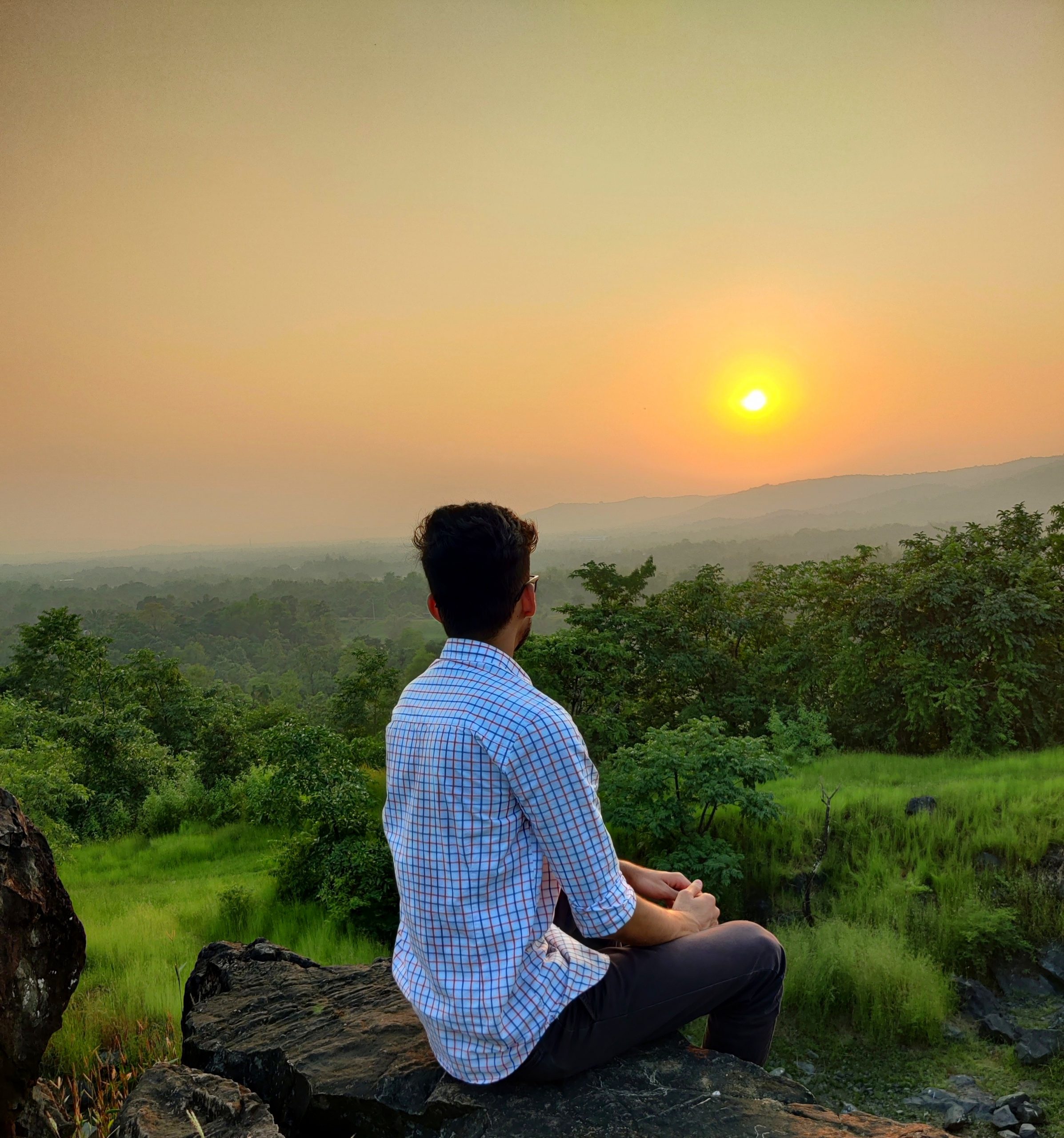 man looking at sunset