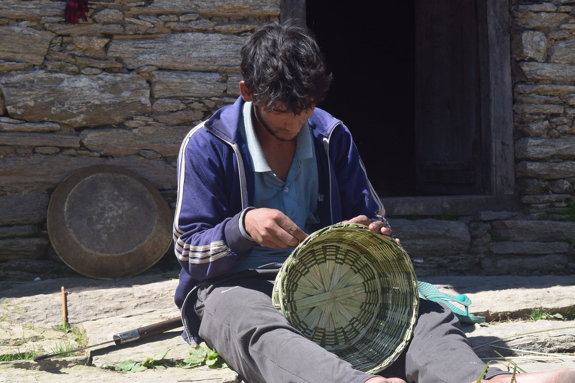 A man making wooden basket