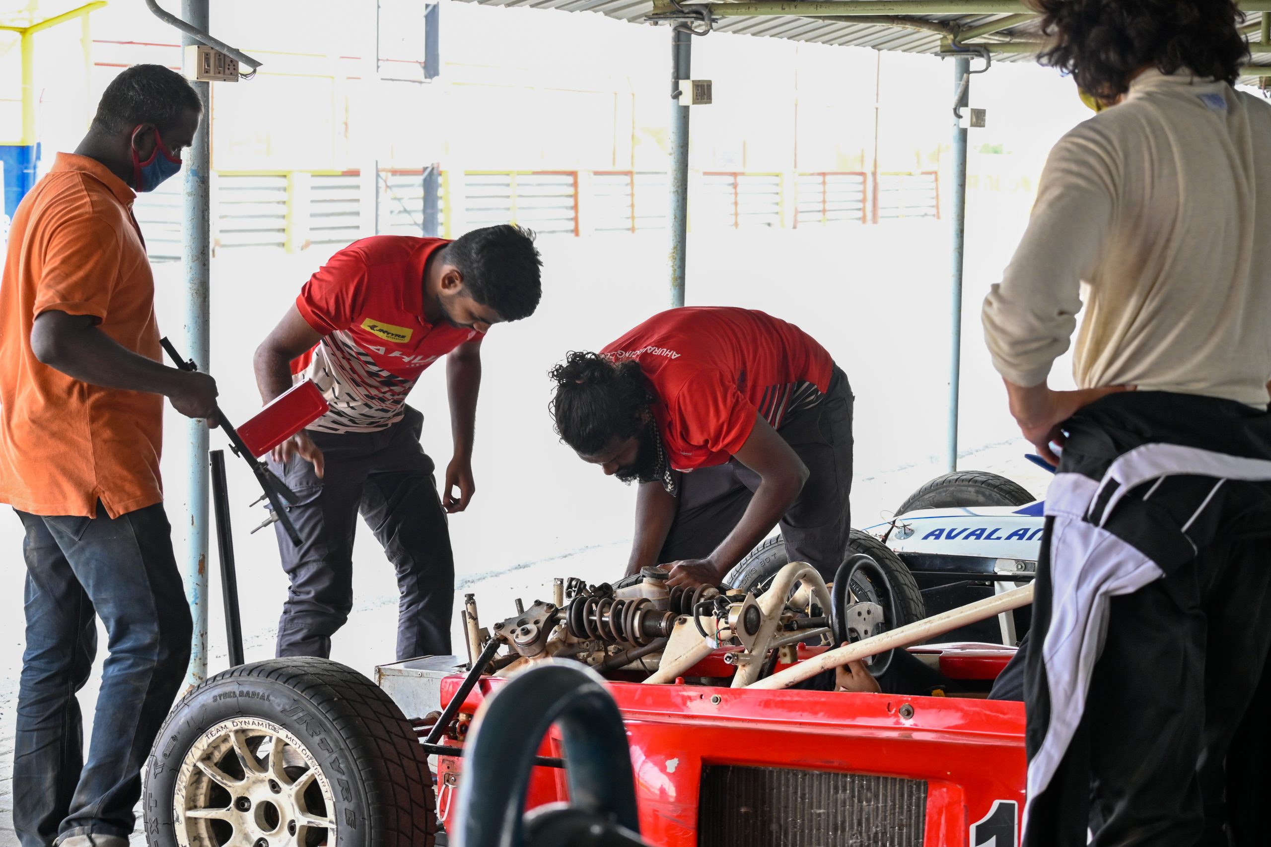 Mechanic crew repairing a car