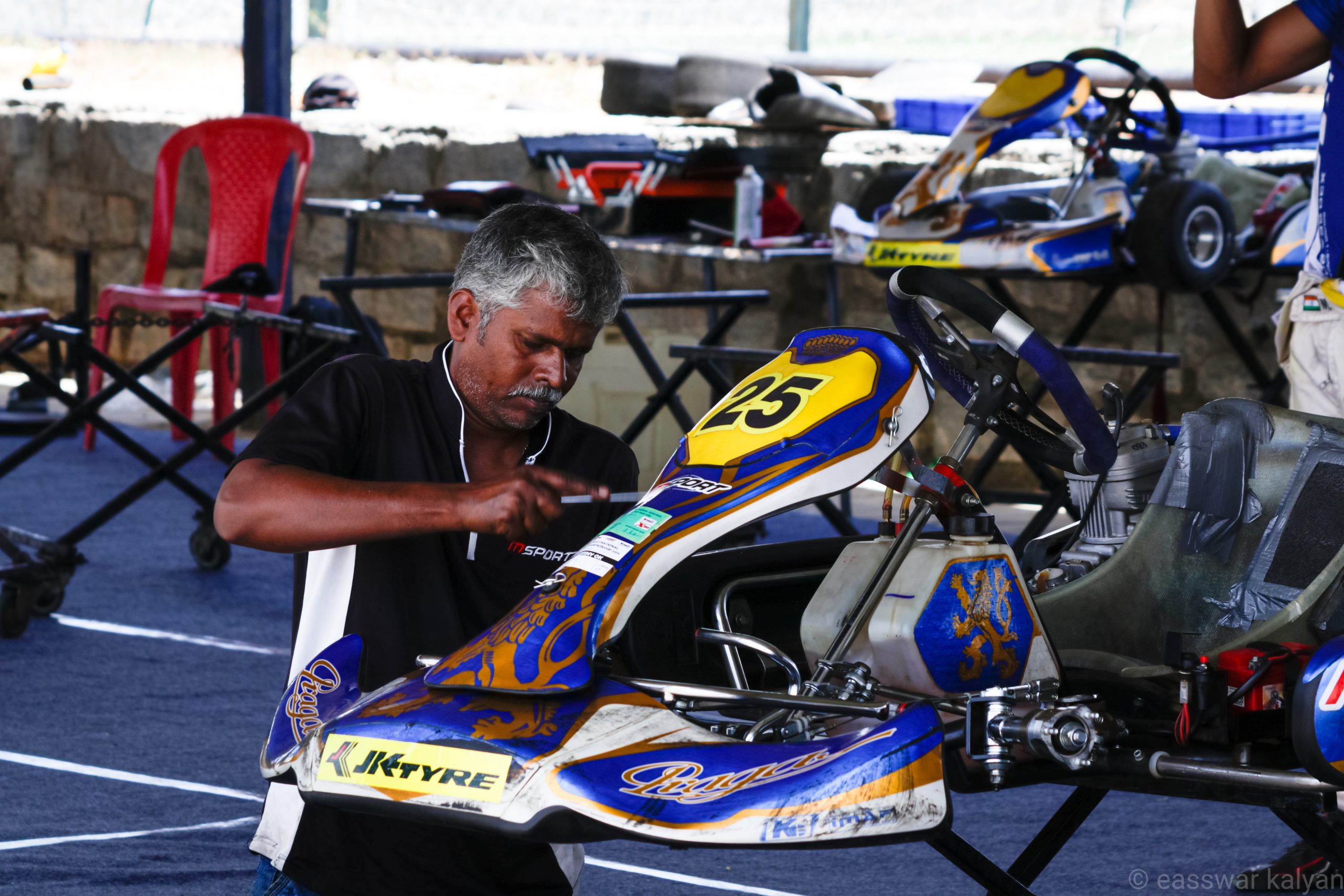 A mechanic repairing kart