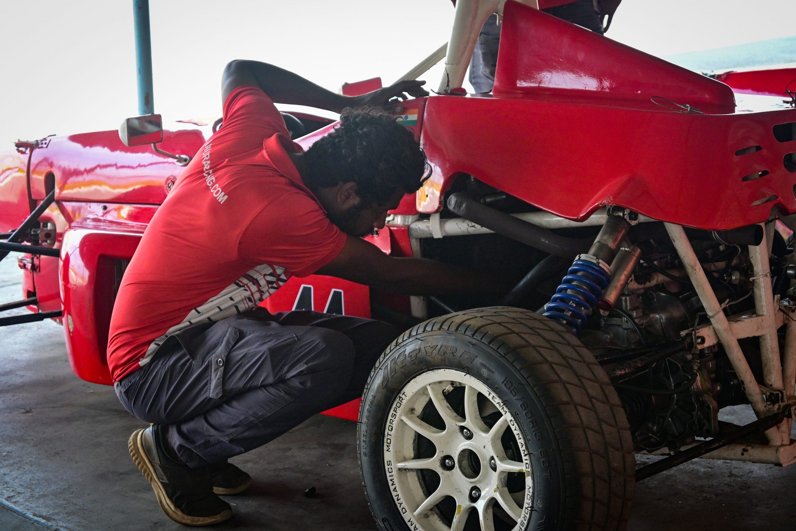 Mechanic working on F1 racing car