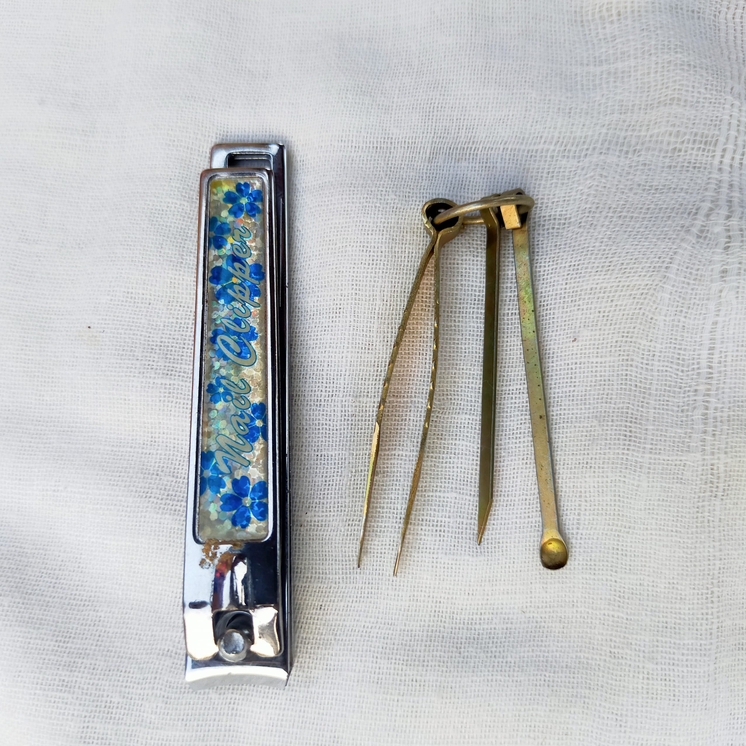 A nail cutter and ear scoops