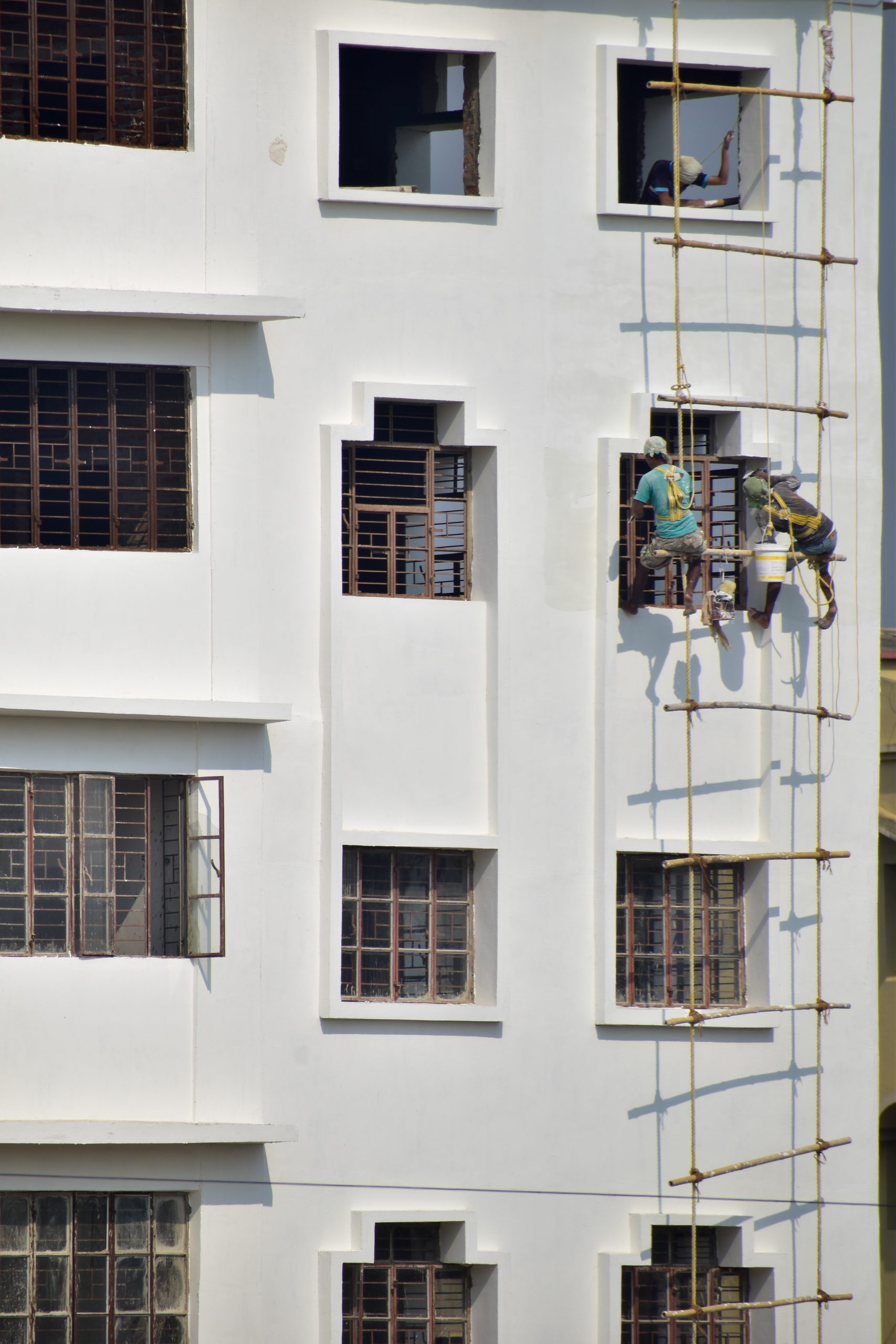Painter Painting a Building