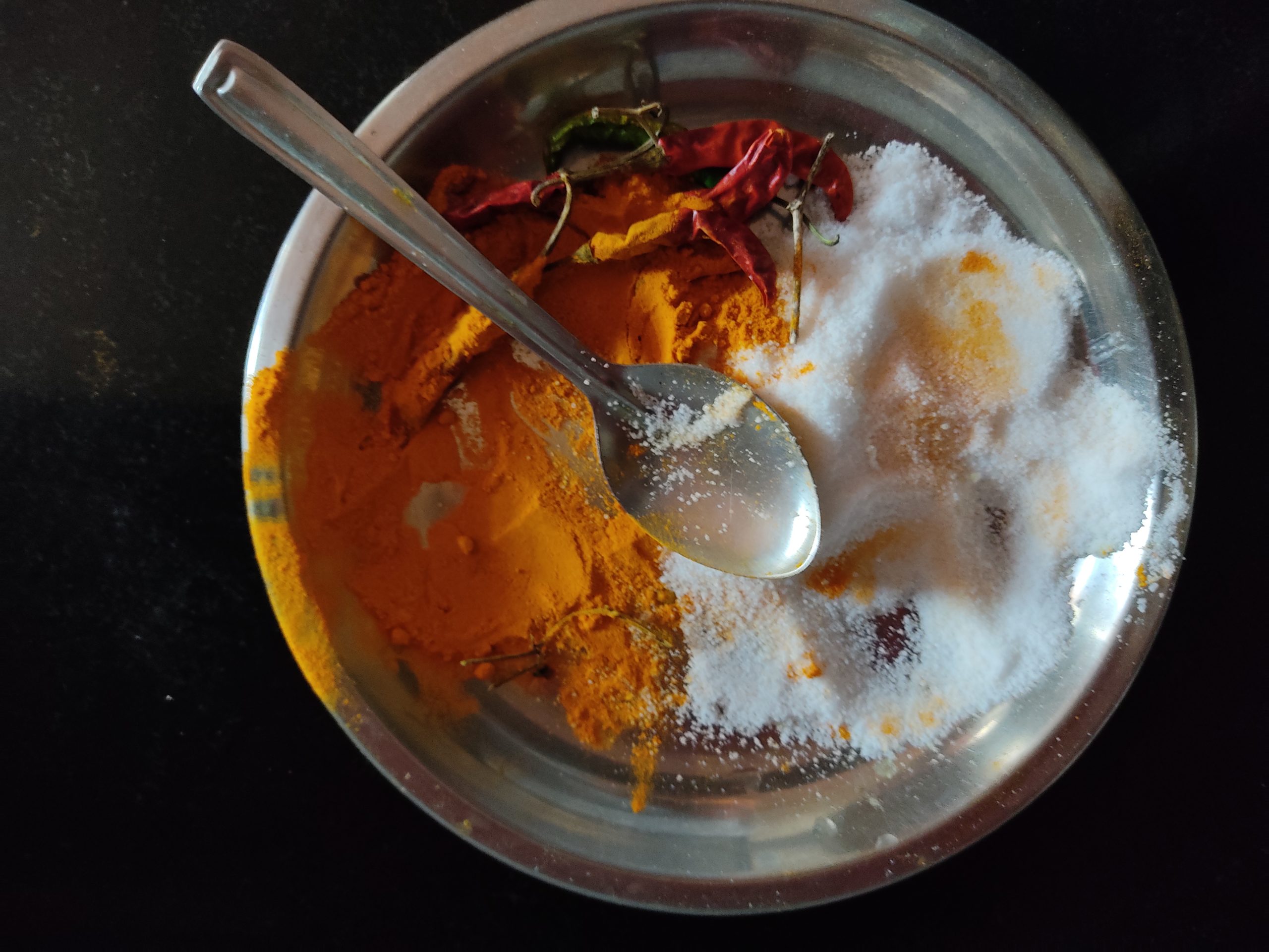 Salt and turmeric in a plate