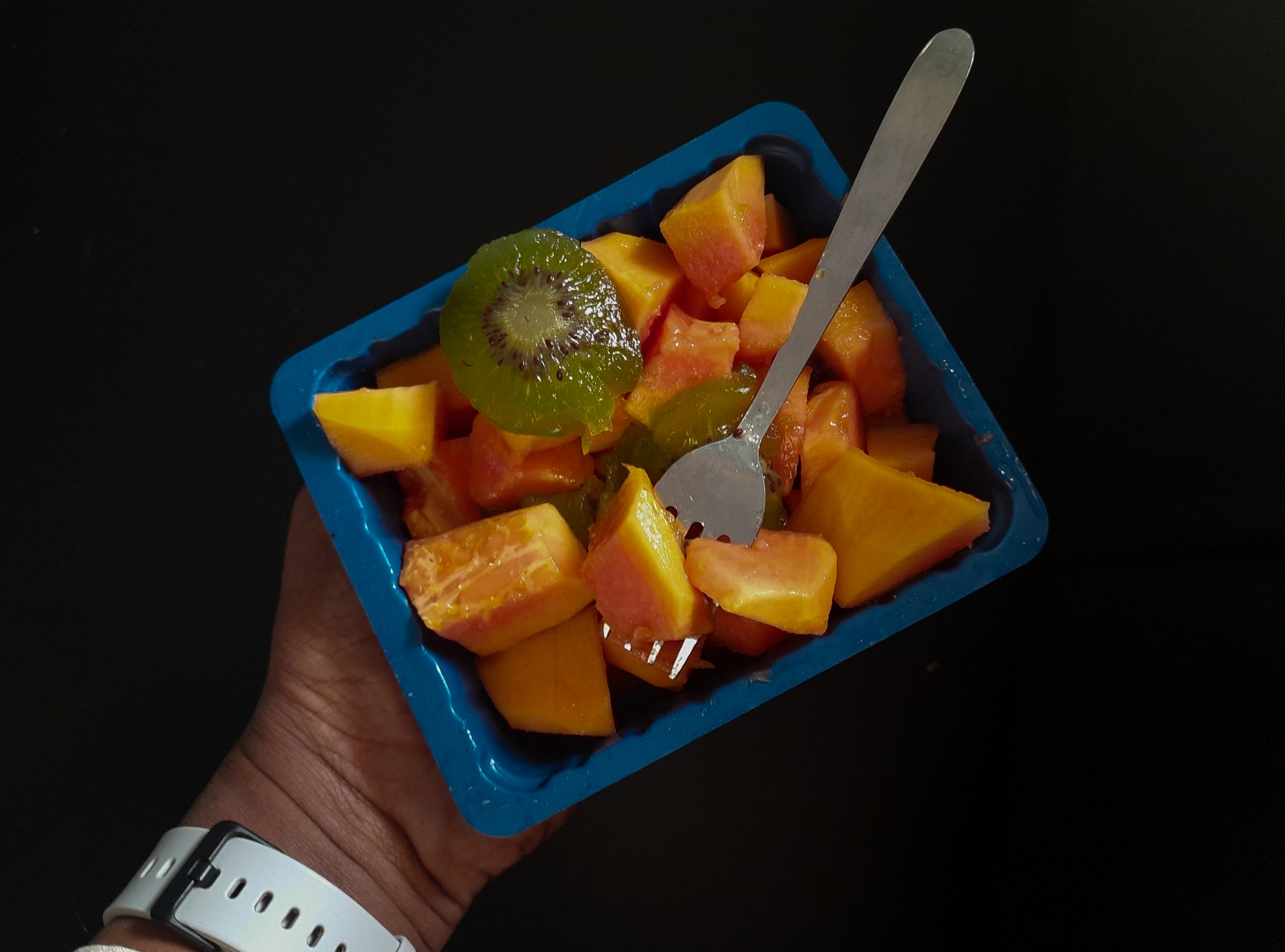 Sliced fruits in a blue box