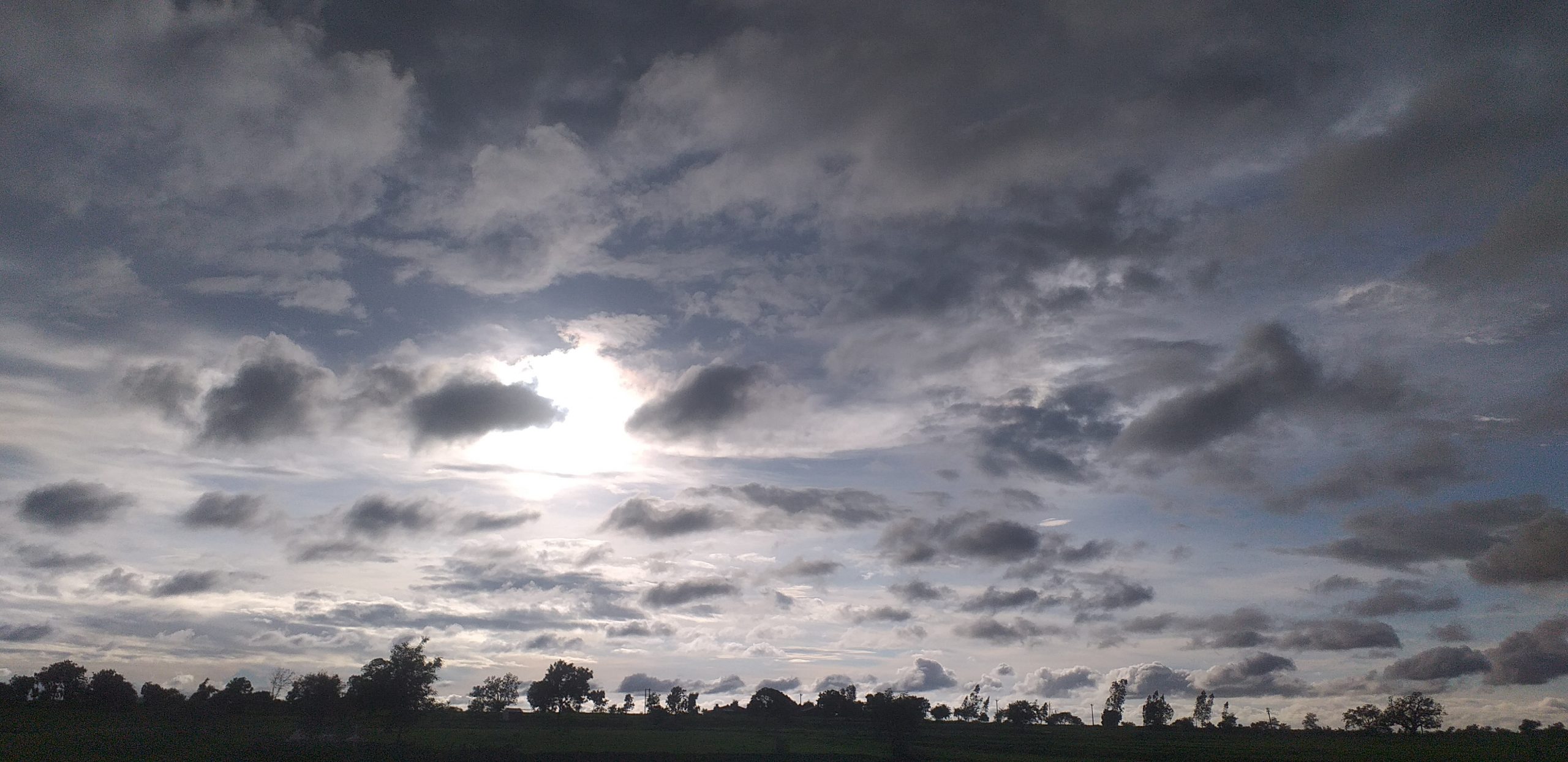 Sun behind clouds