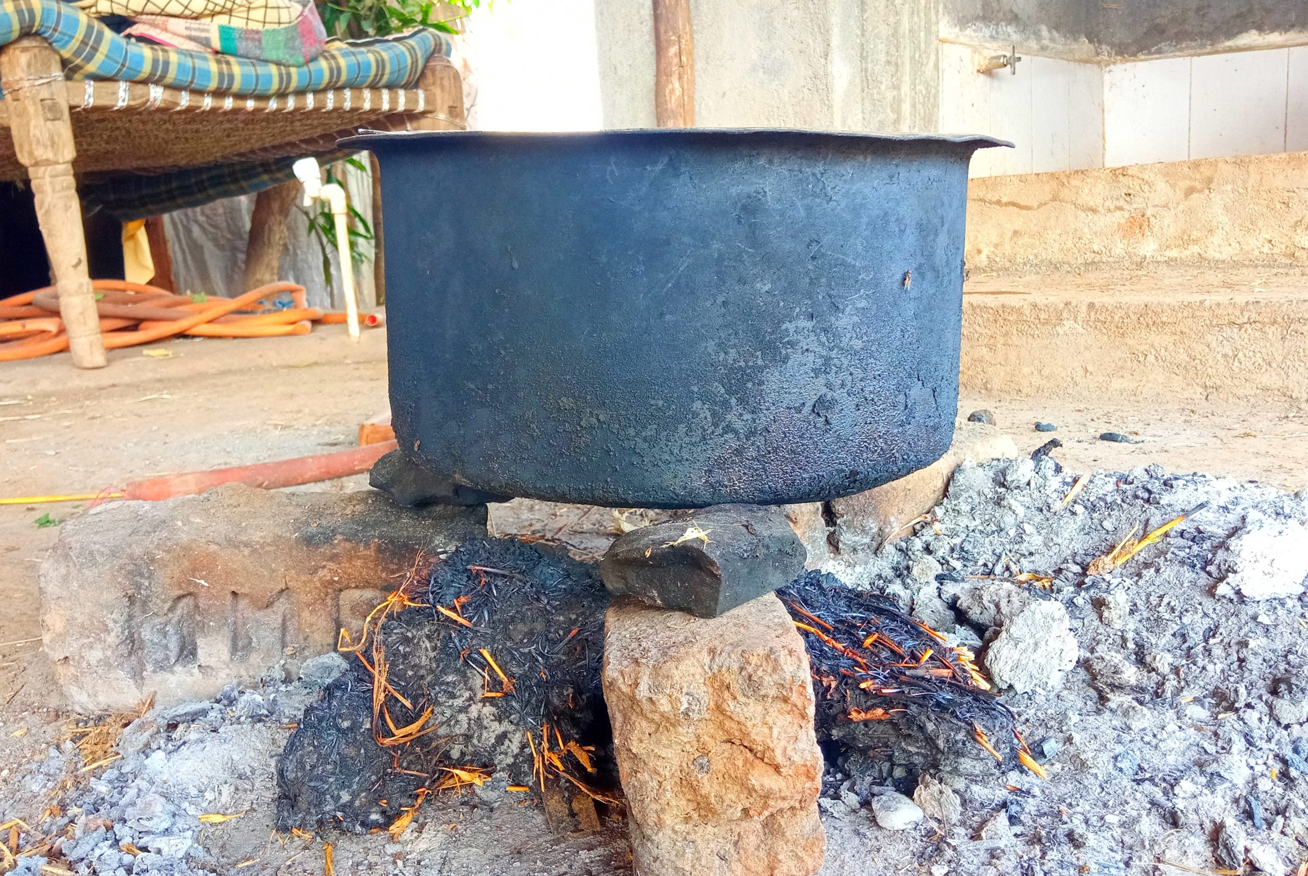 A water pot on bricks stove