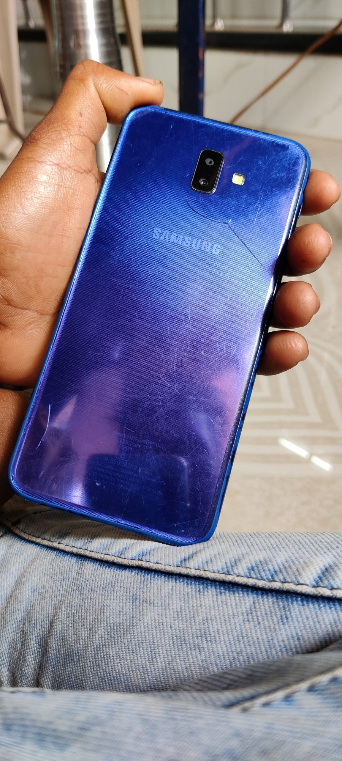 A Samsung mobile phone in hand