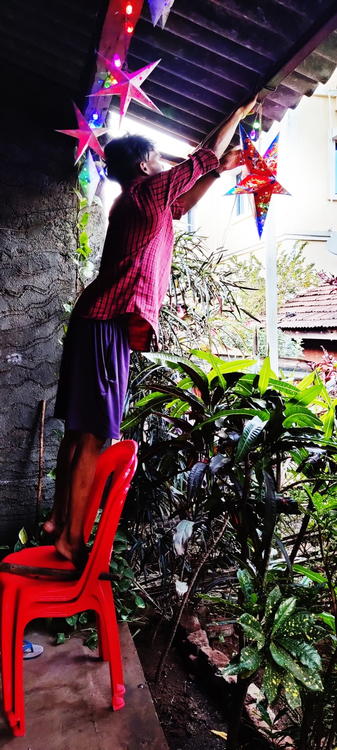 A boy decorating his house