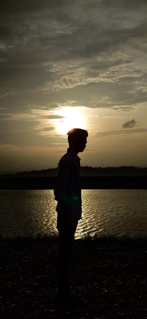 A boy, lake and sunset - PixaHive