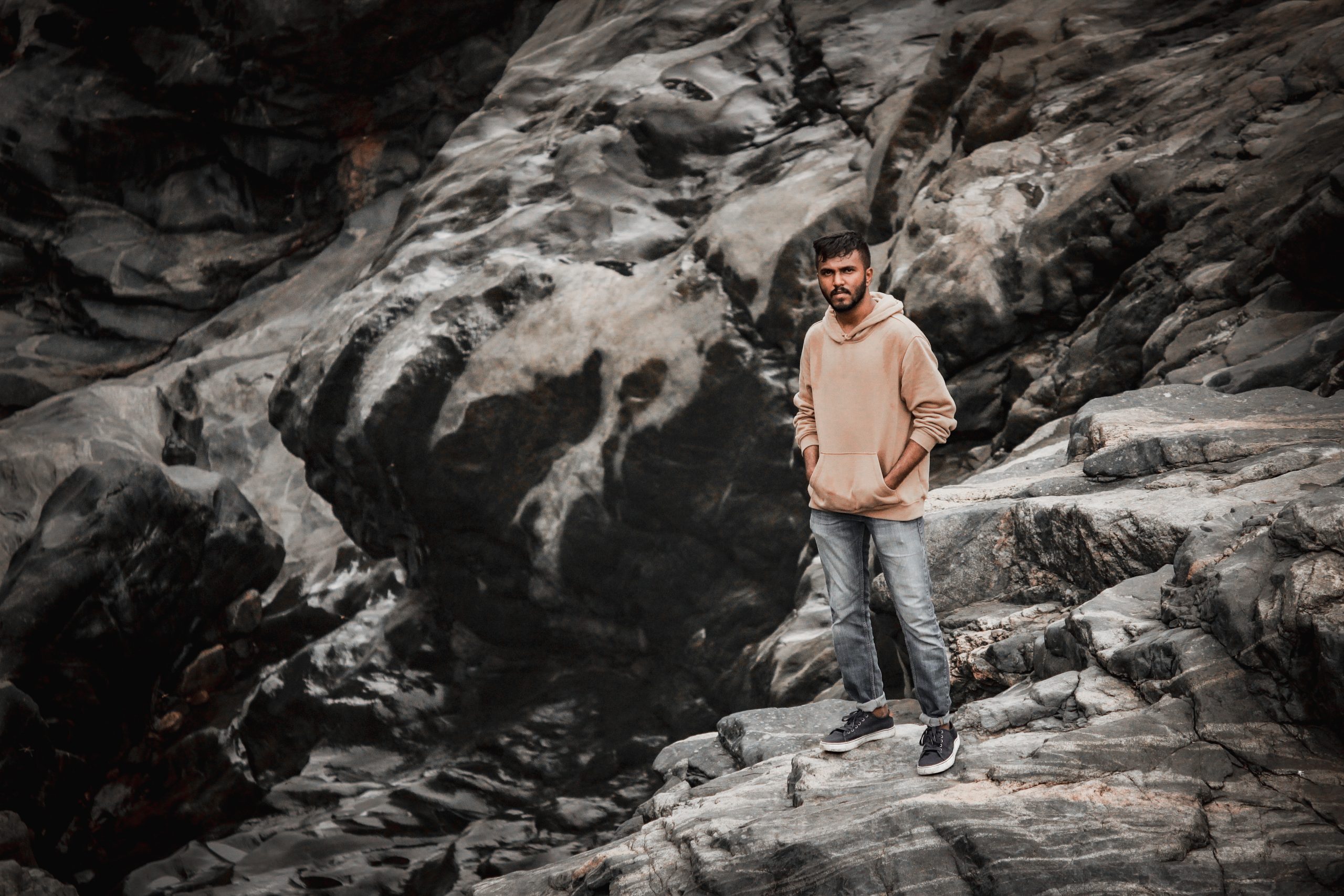 A boy on a rocky hill