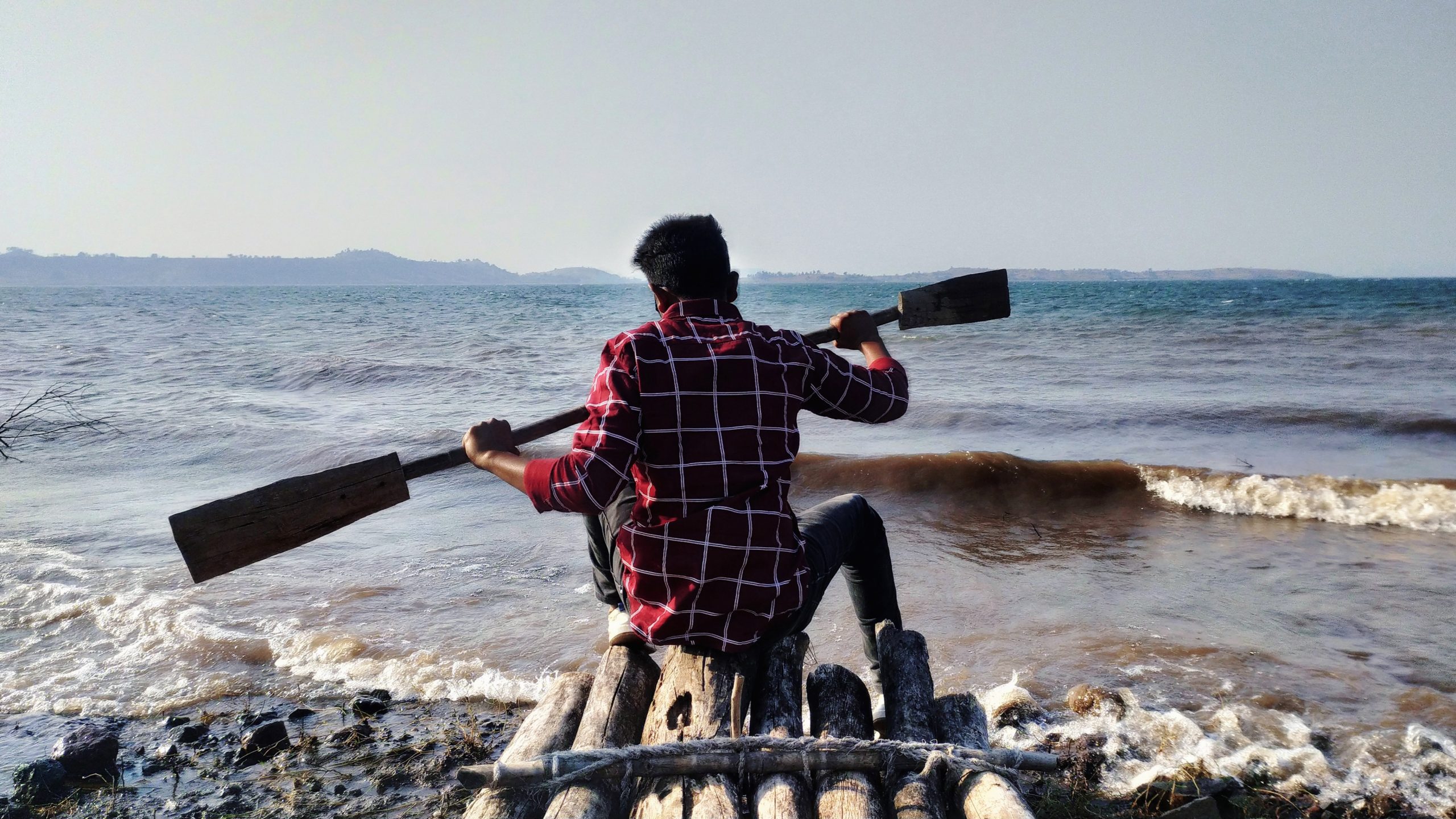 A boy on wooden boat