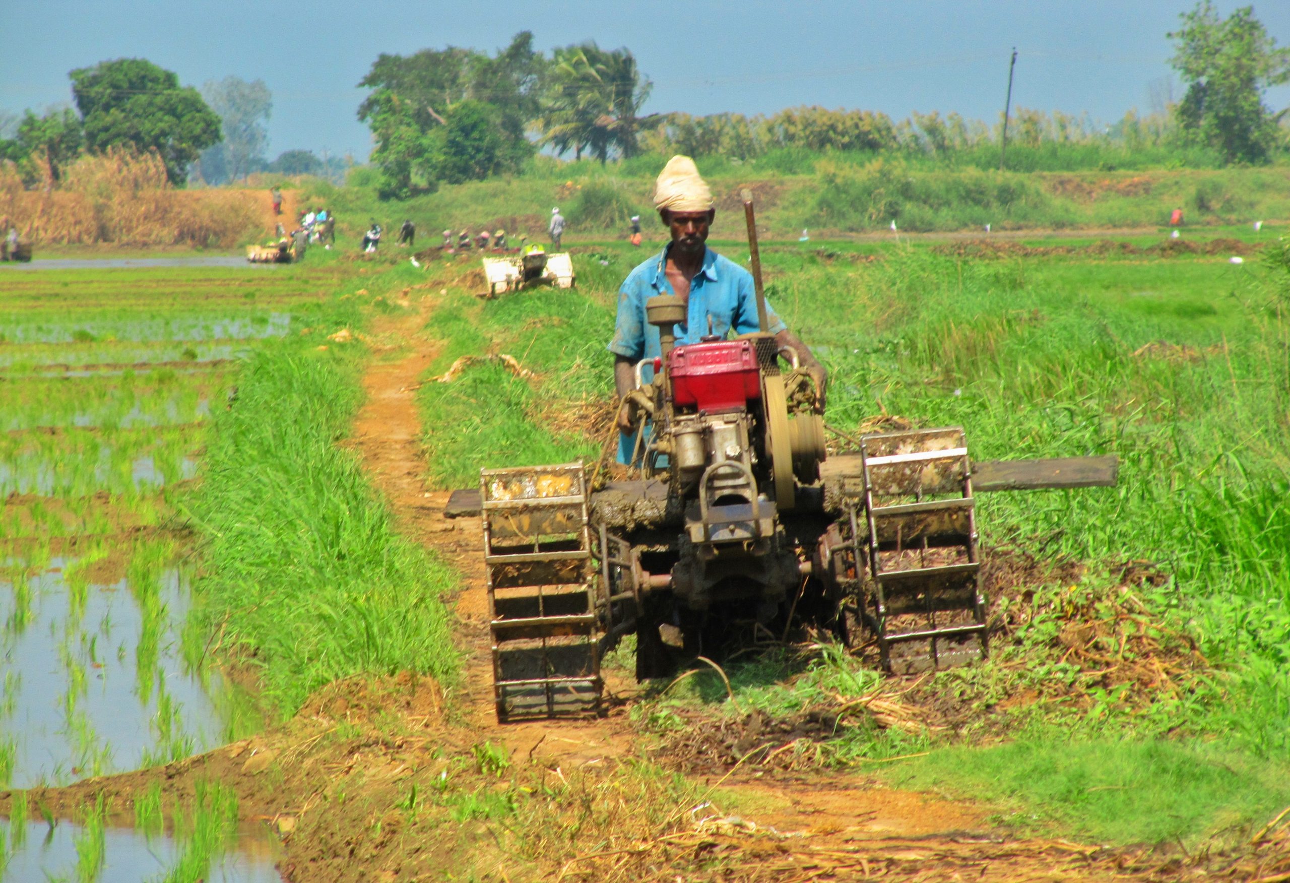 A farmer with farming machine