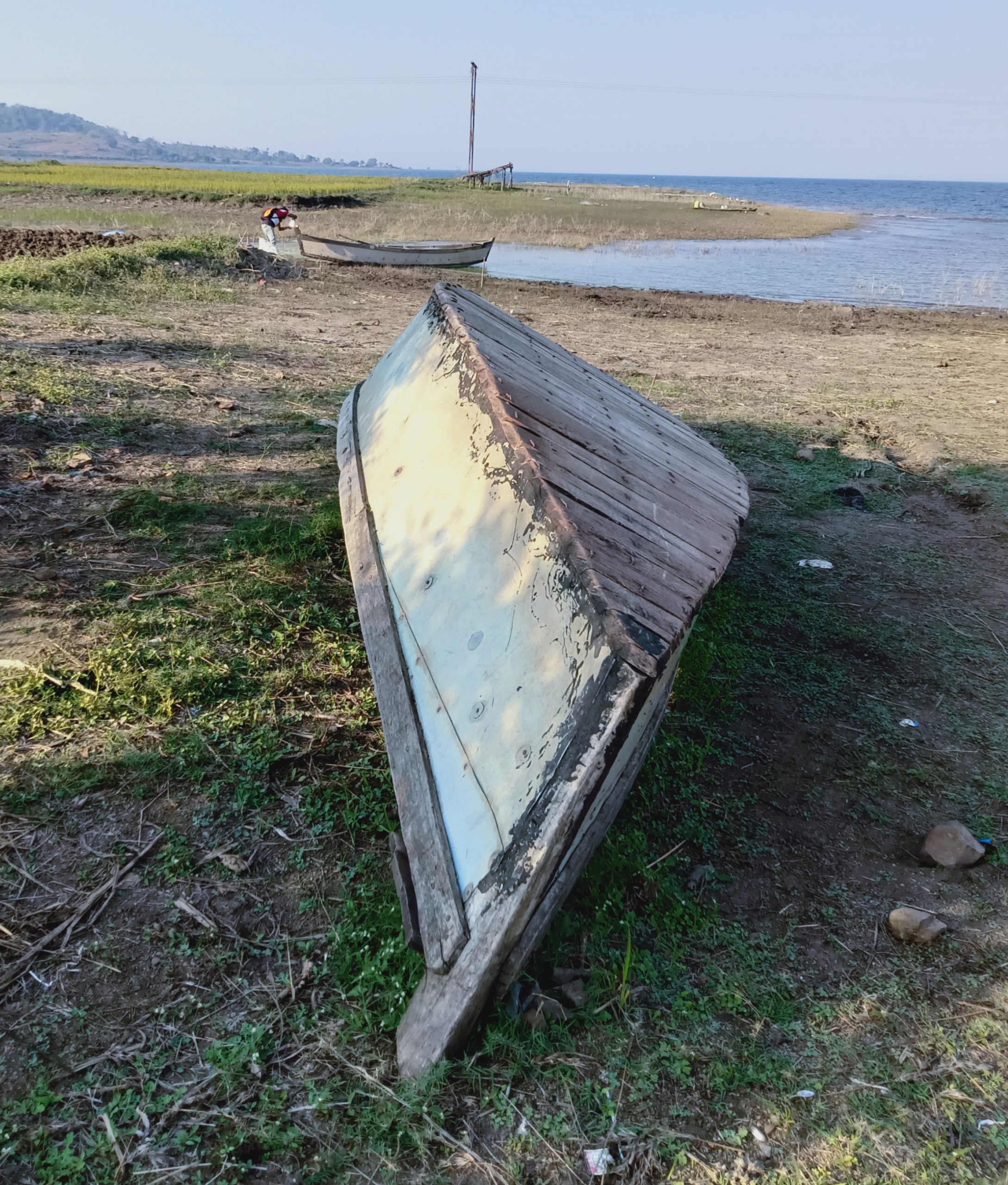 A tilted boat on a beach