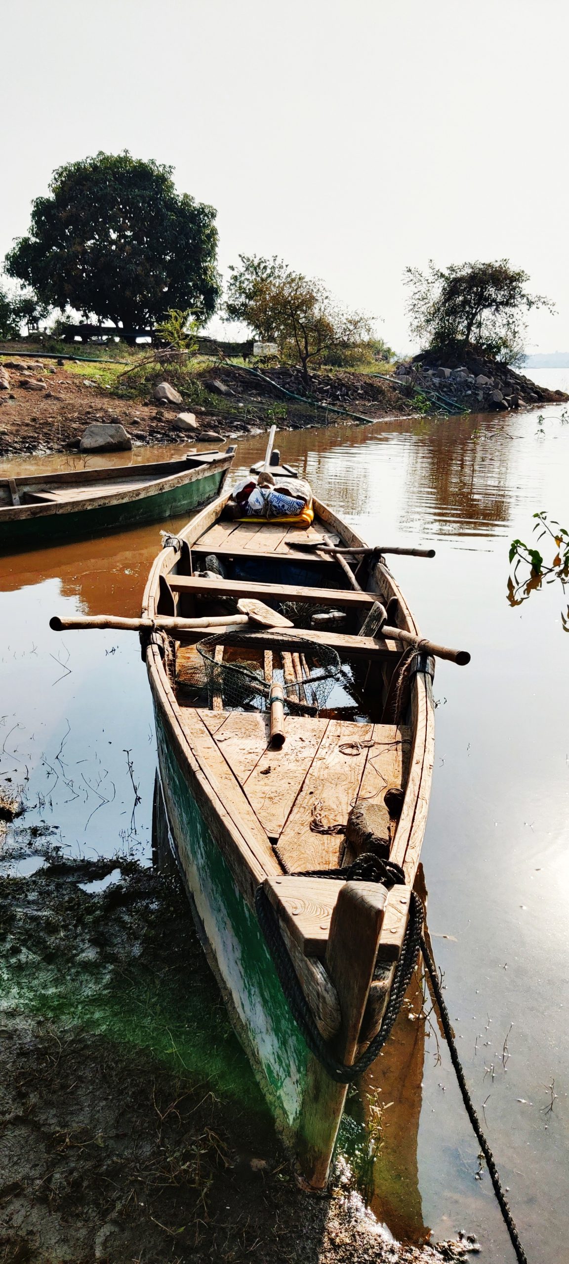 A wooden boat at a shore