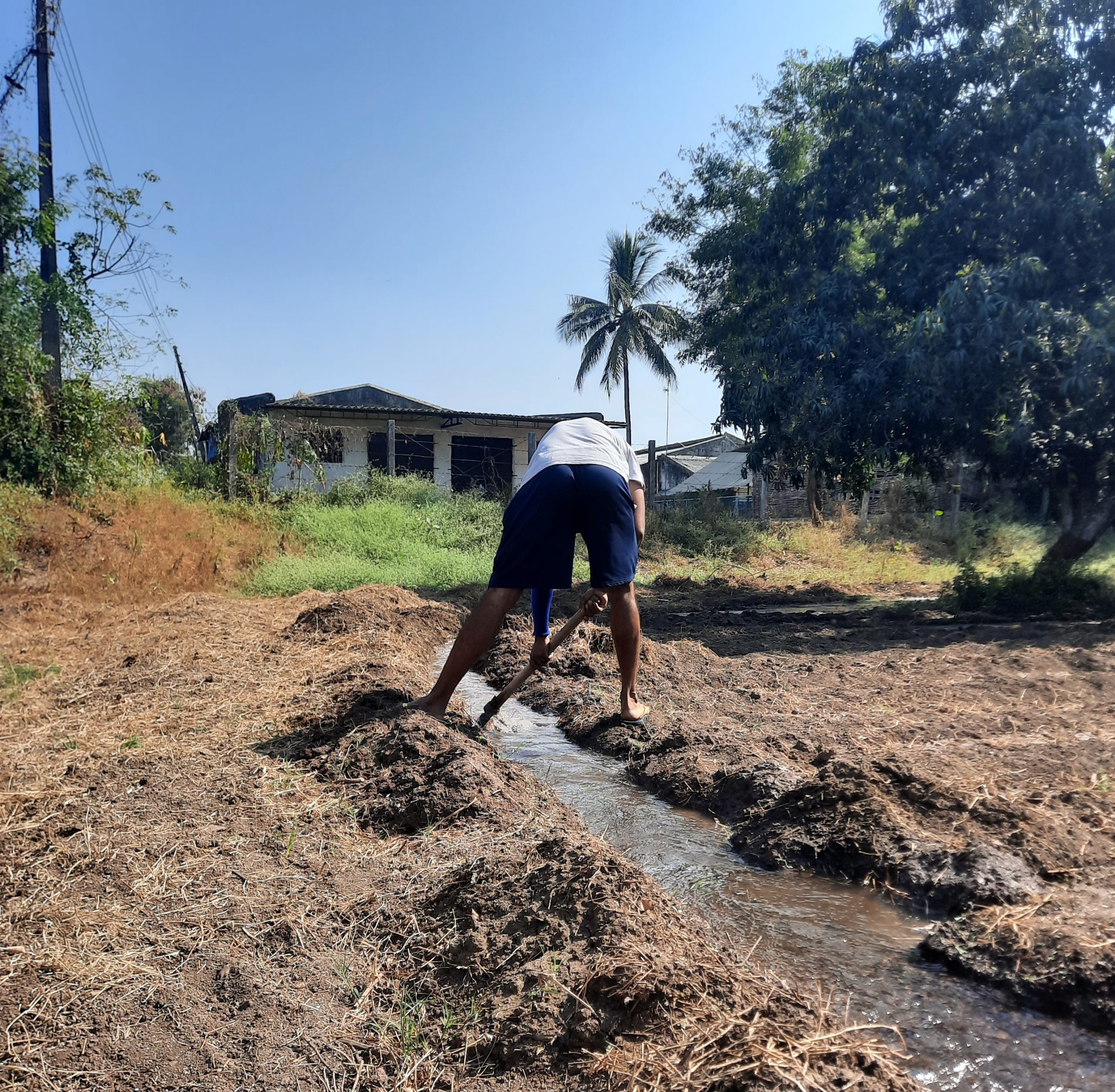 A farmer making waterway to his fields