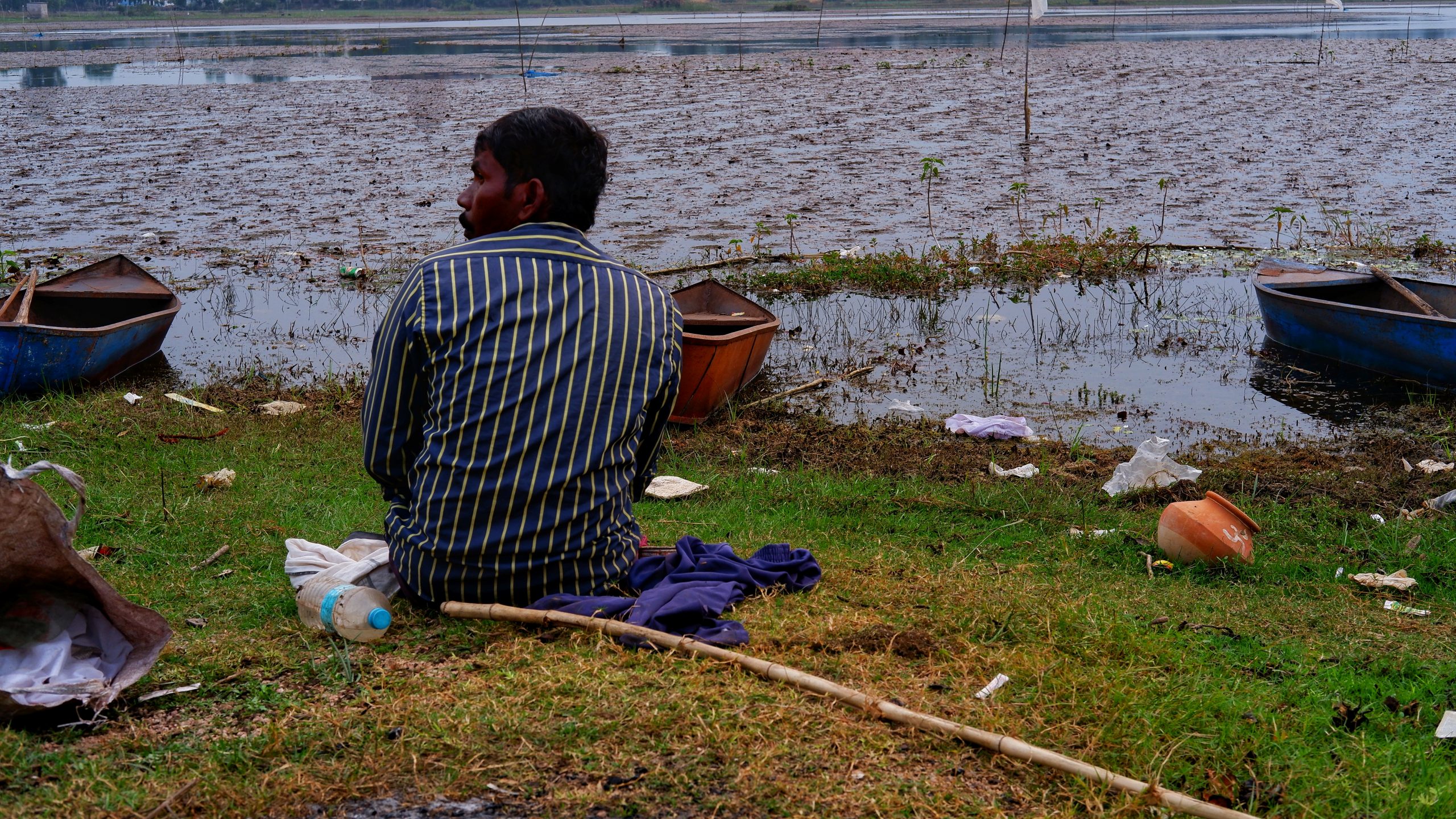 A fisherman at riverbank