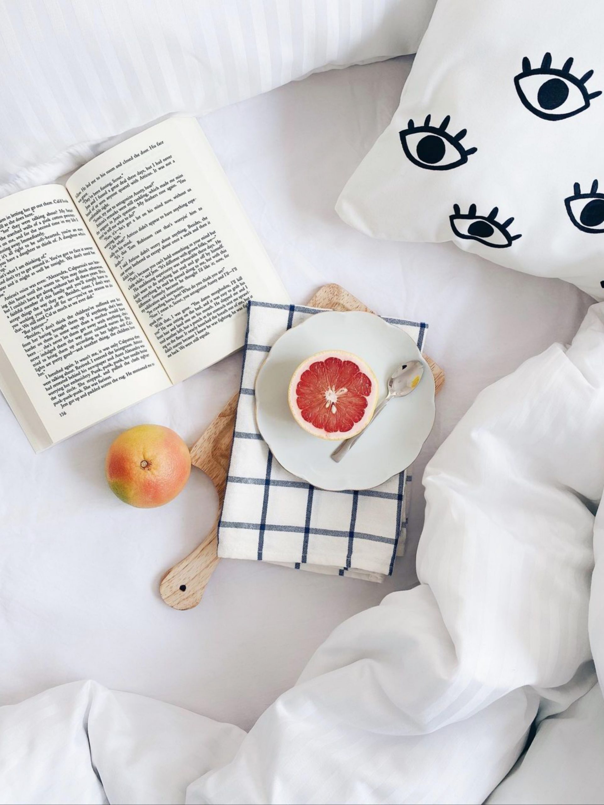 Fruit on the bed with book