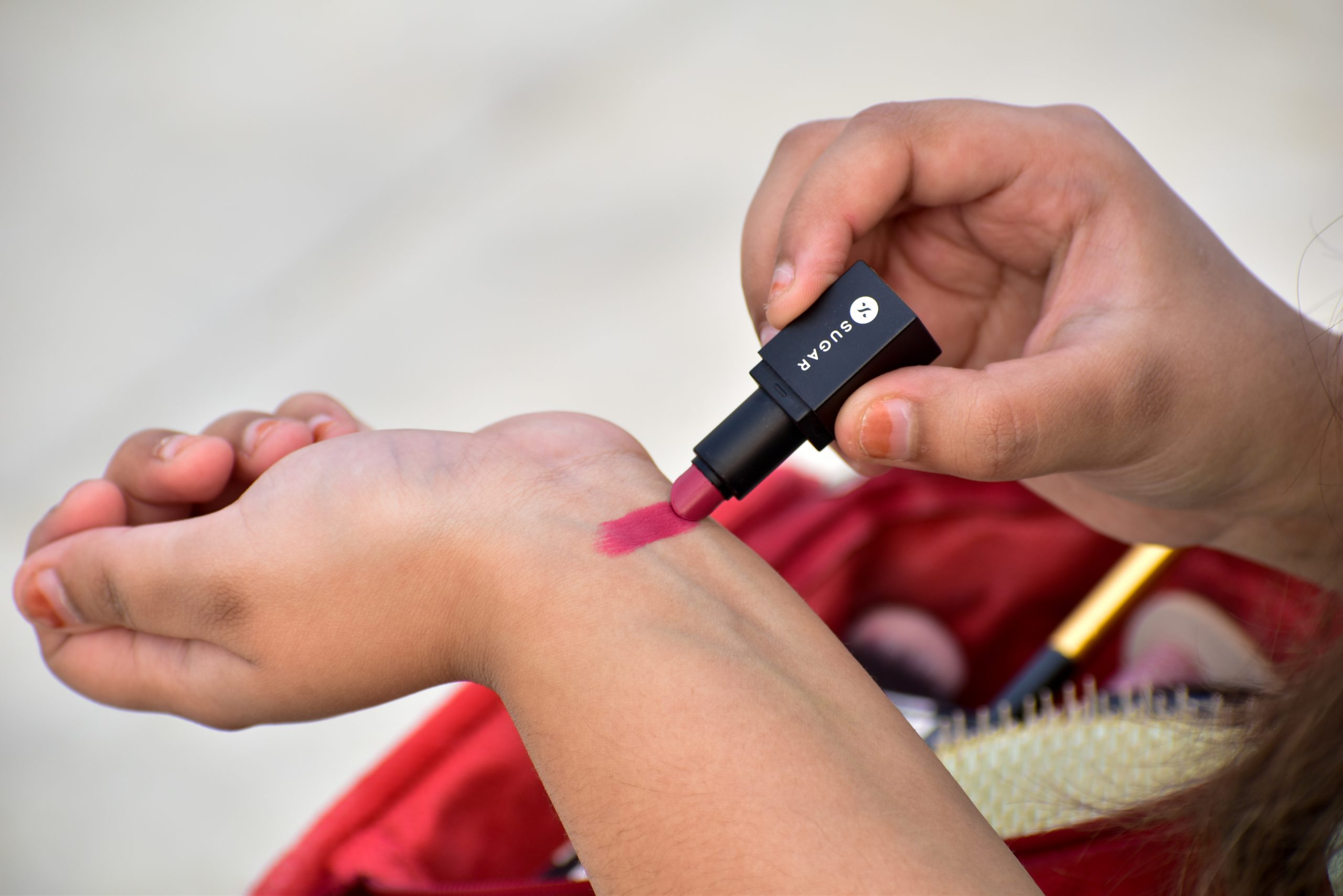 A girl testing lip stick