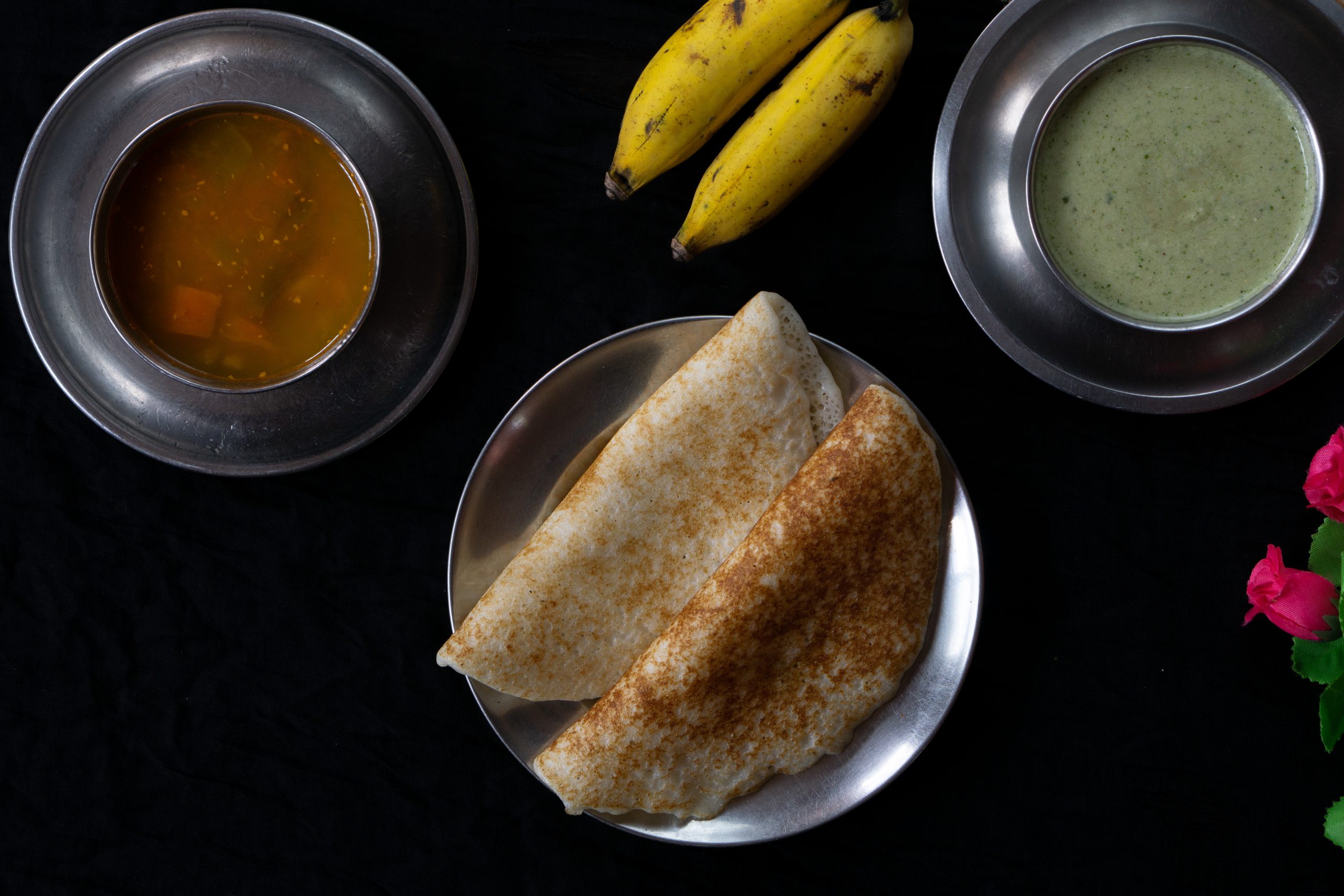 dosa with sambar, chutney and bananas