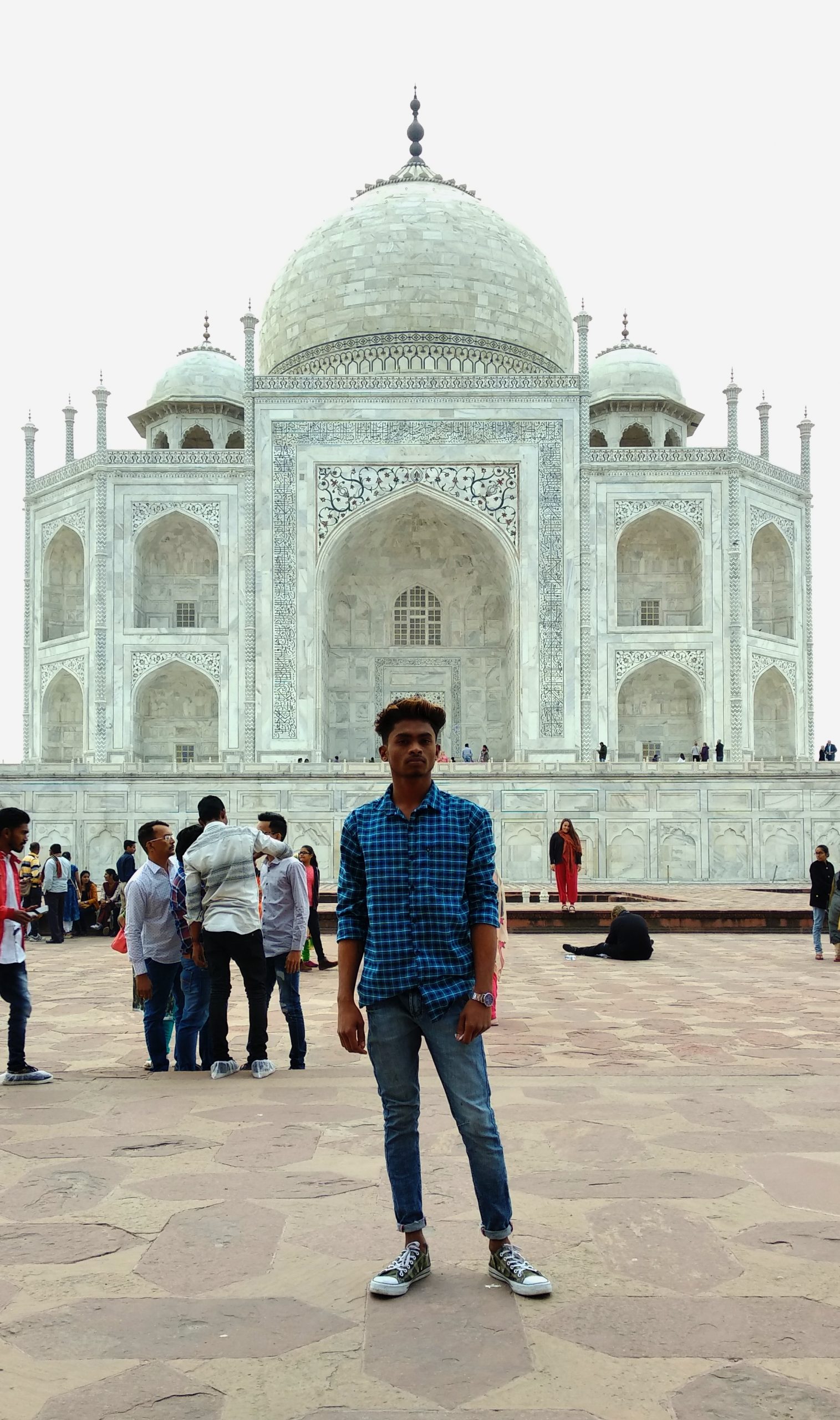 Boy posing in front Taj Mahal
