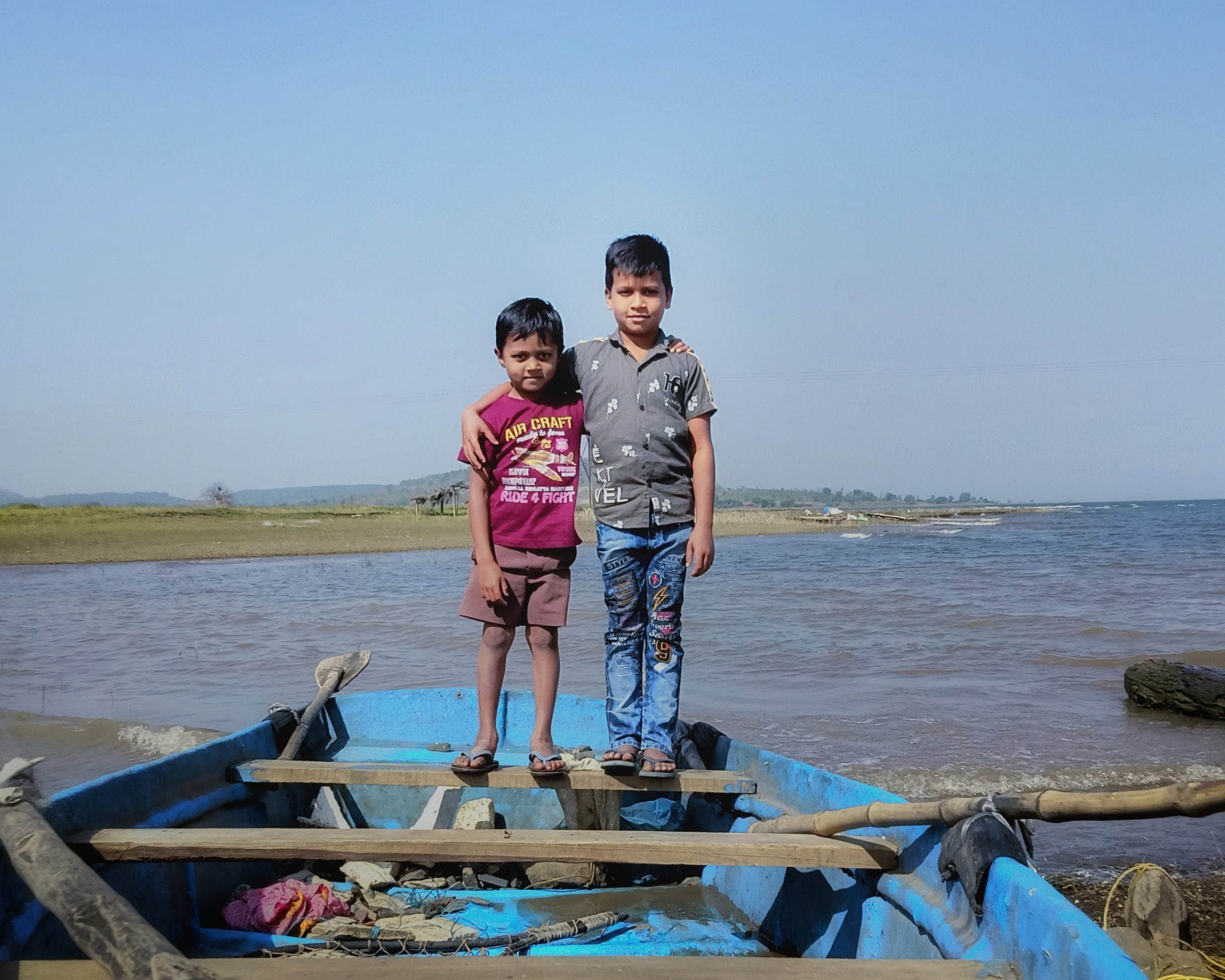 Kids posing on boat