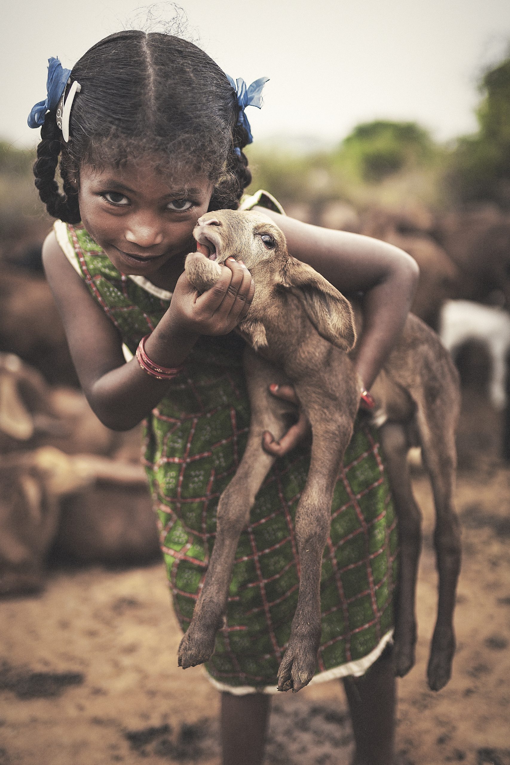 Girl with baby goat