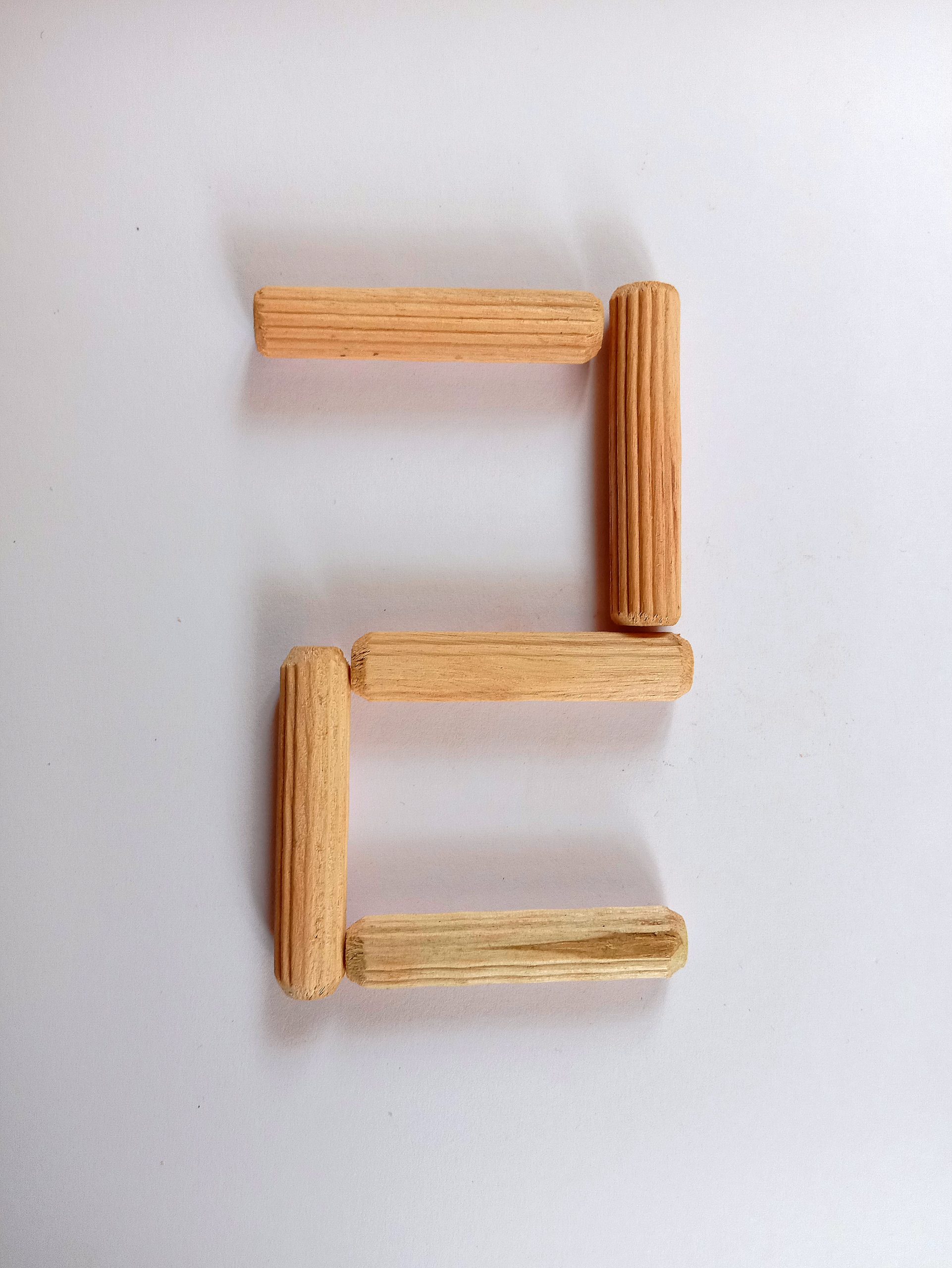 Number 2 written with wooden sticks