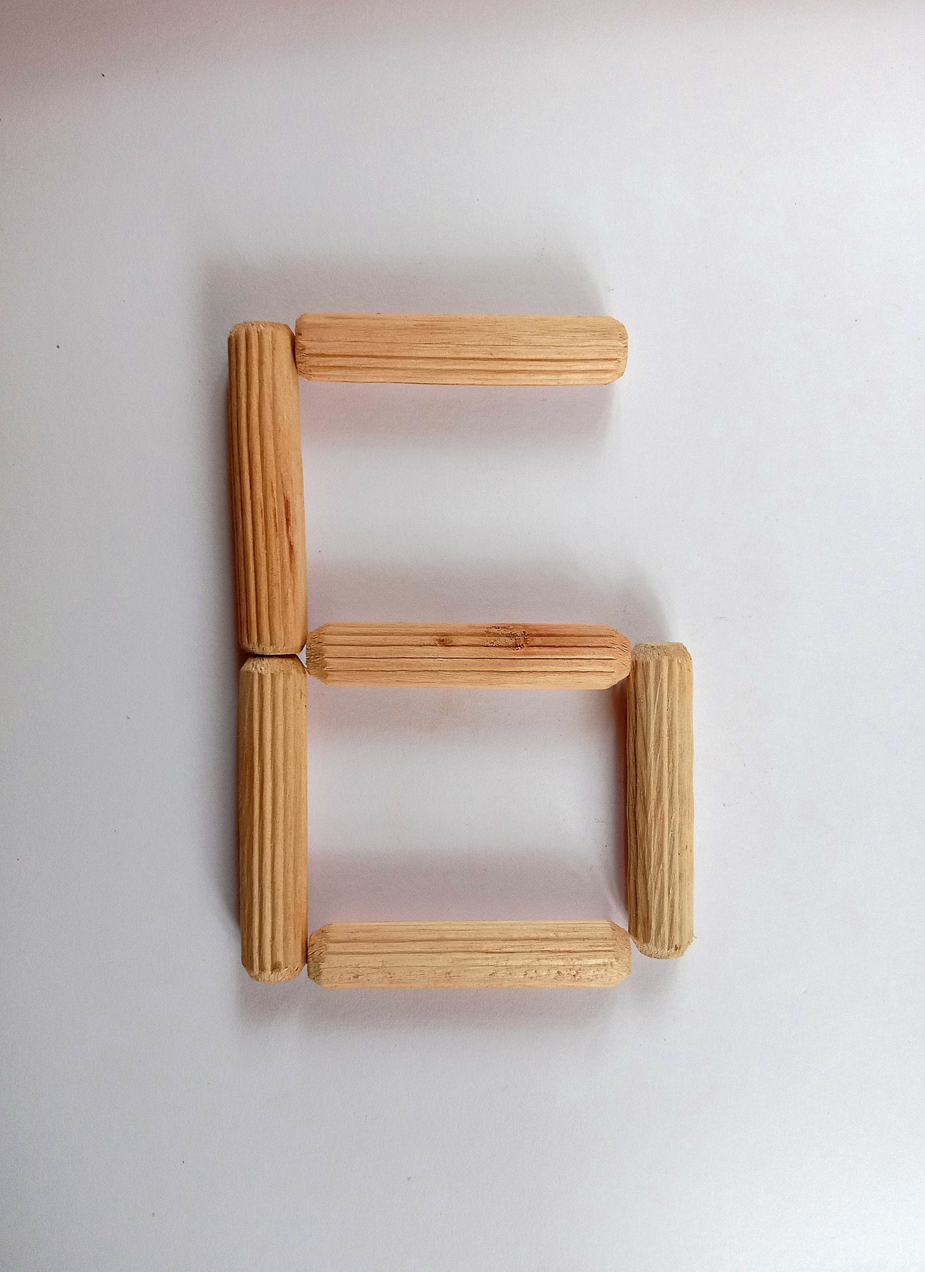 Number 6 written with sticks