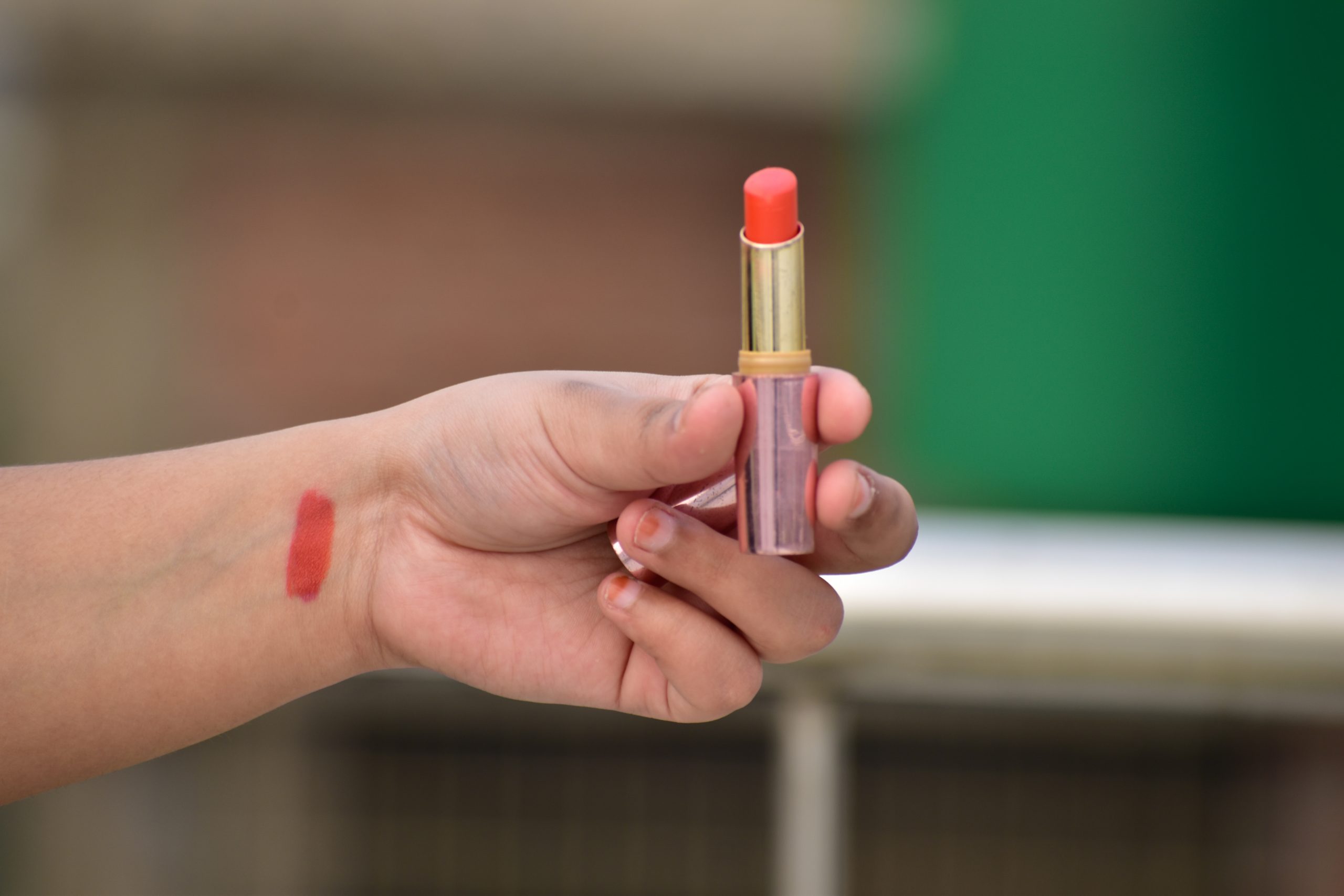 A lipstick in hand