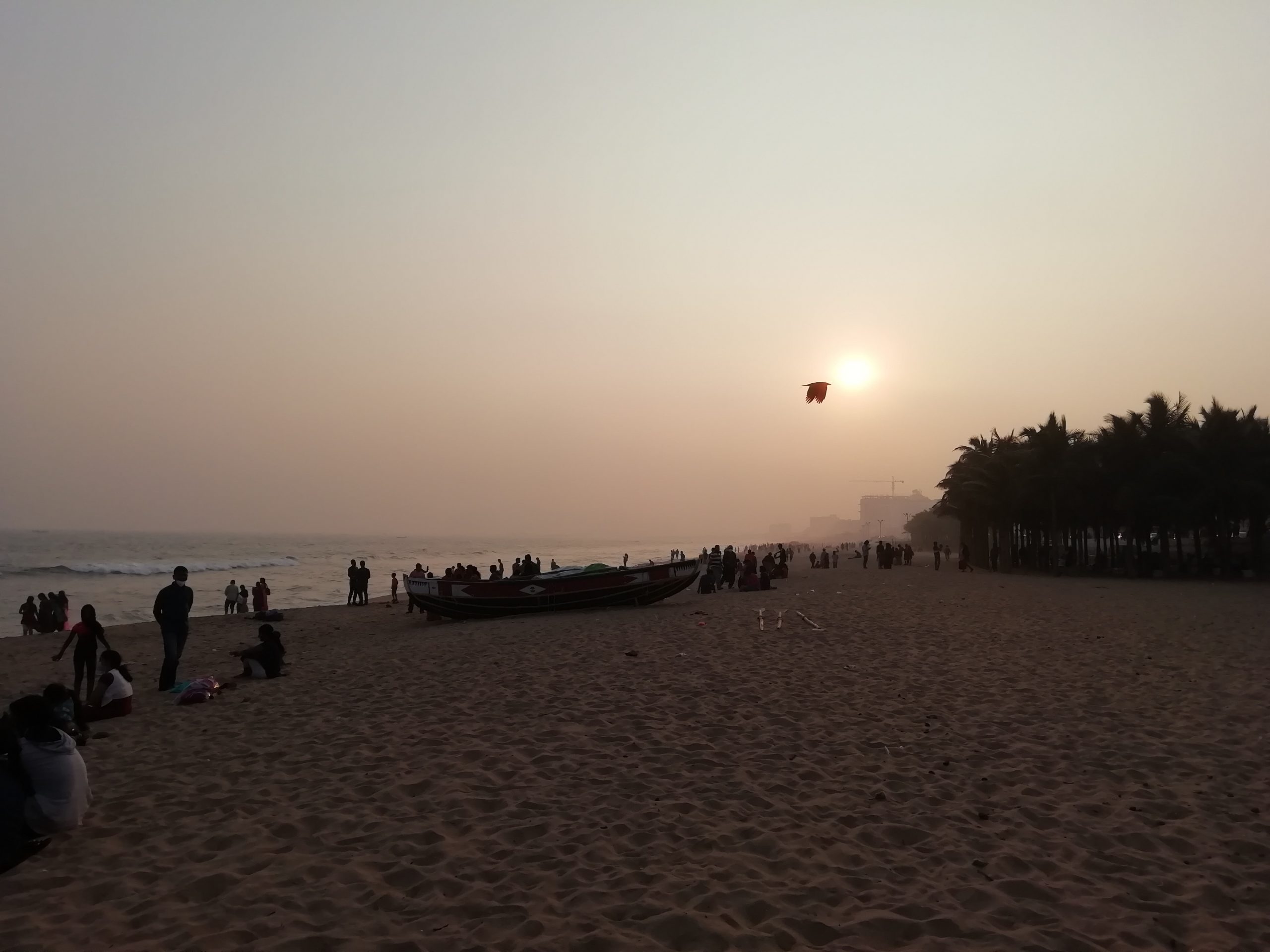 People enjoying sunset at beach