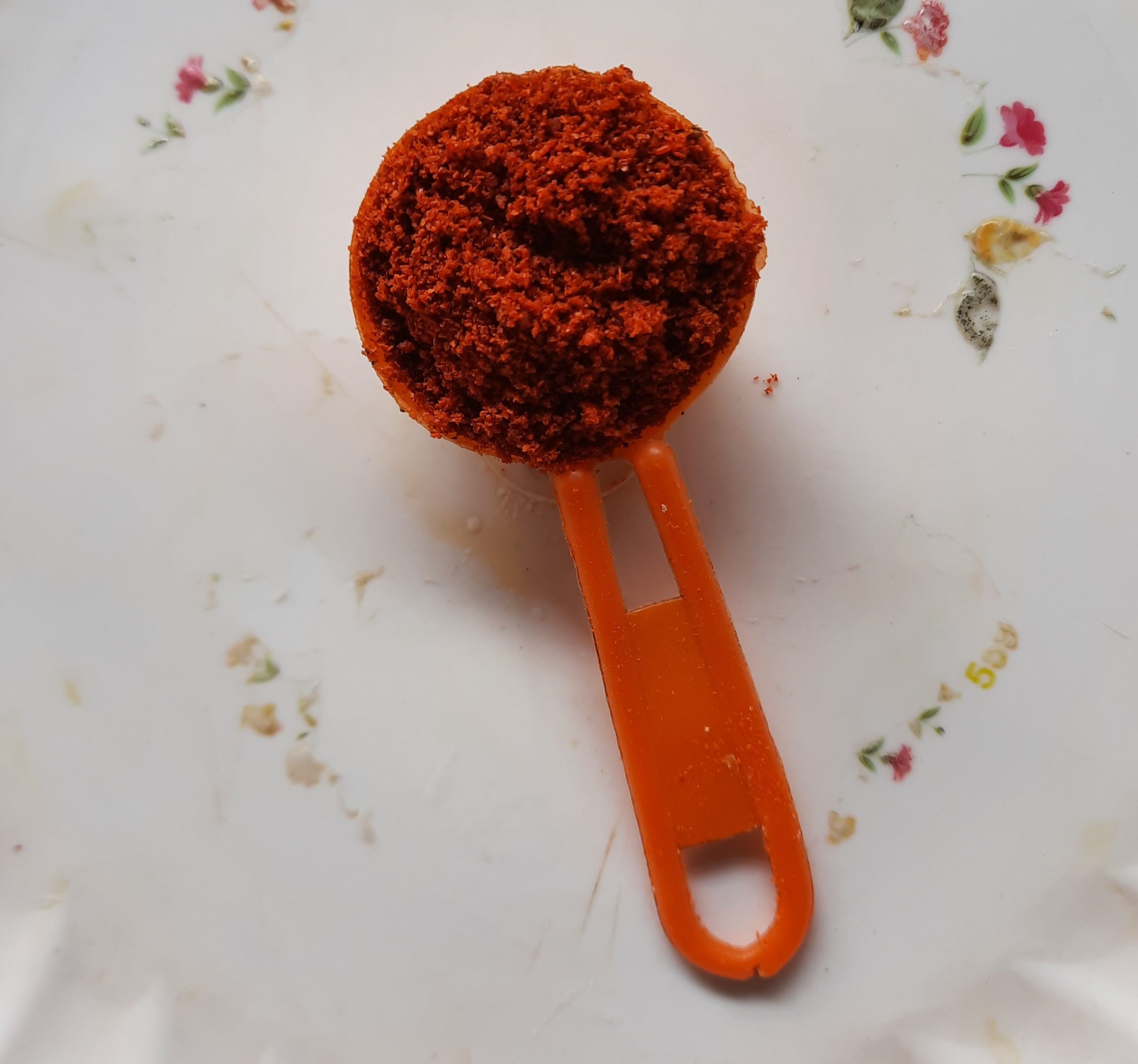 Red Chilli powder in a spoon