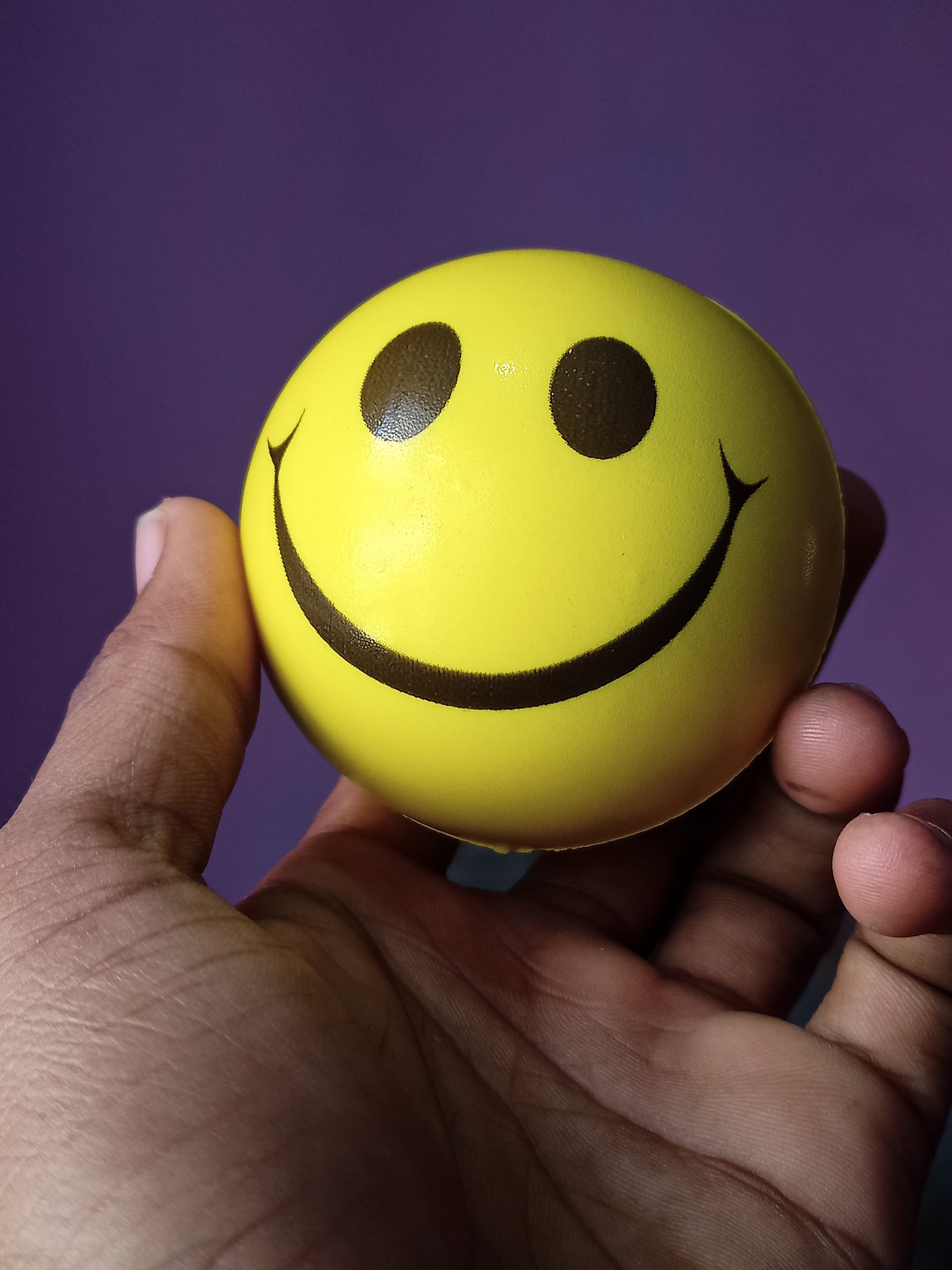 smiley ball in hand