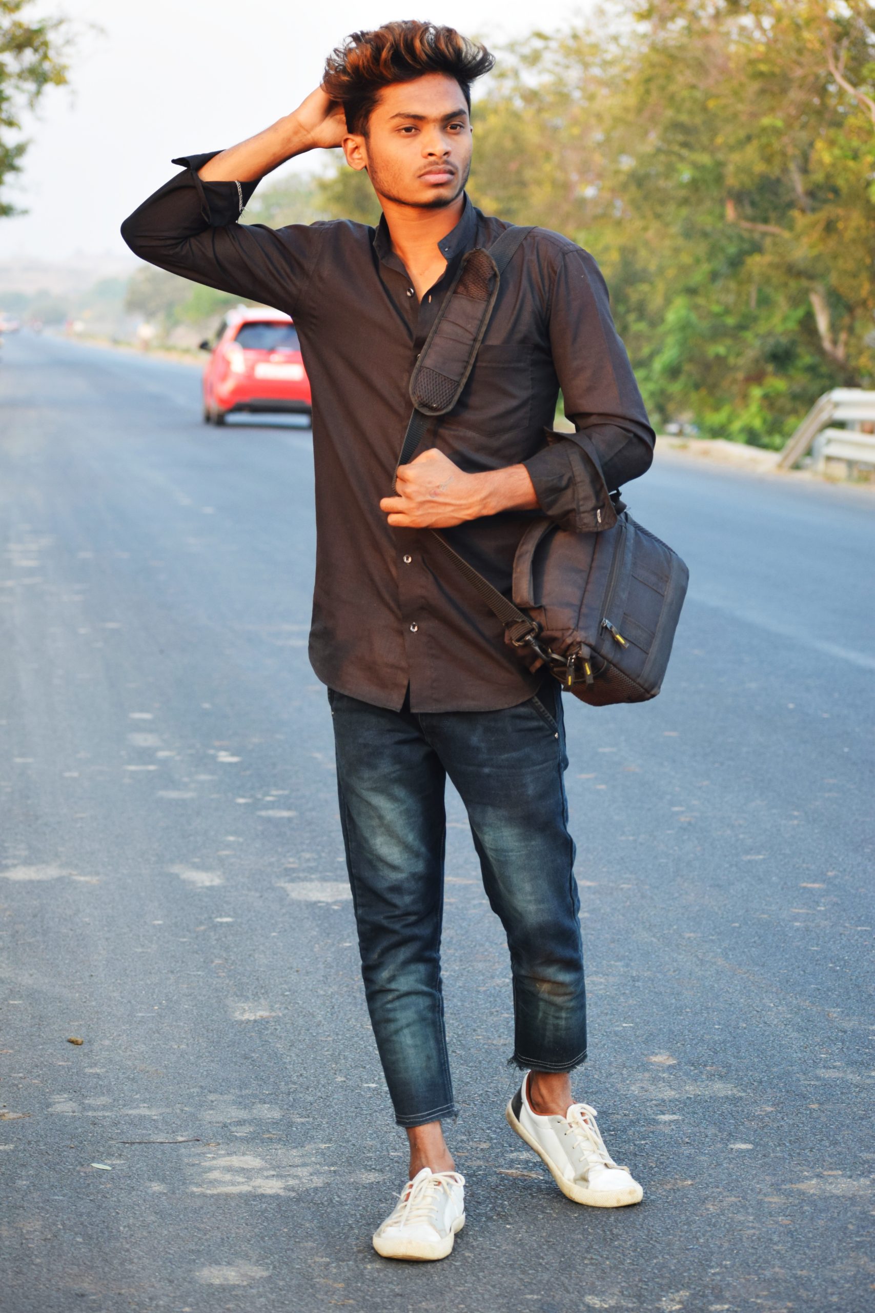 Boy posing on road