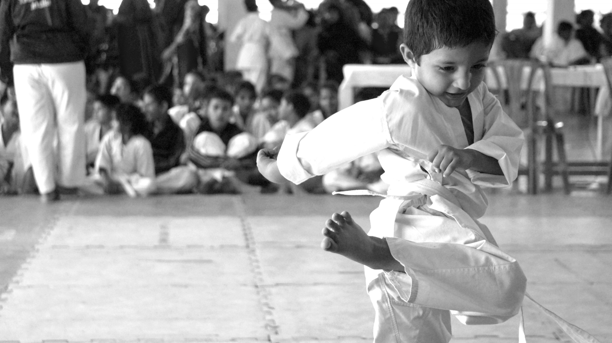 A kid practicing Taekwondo