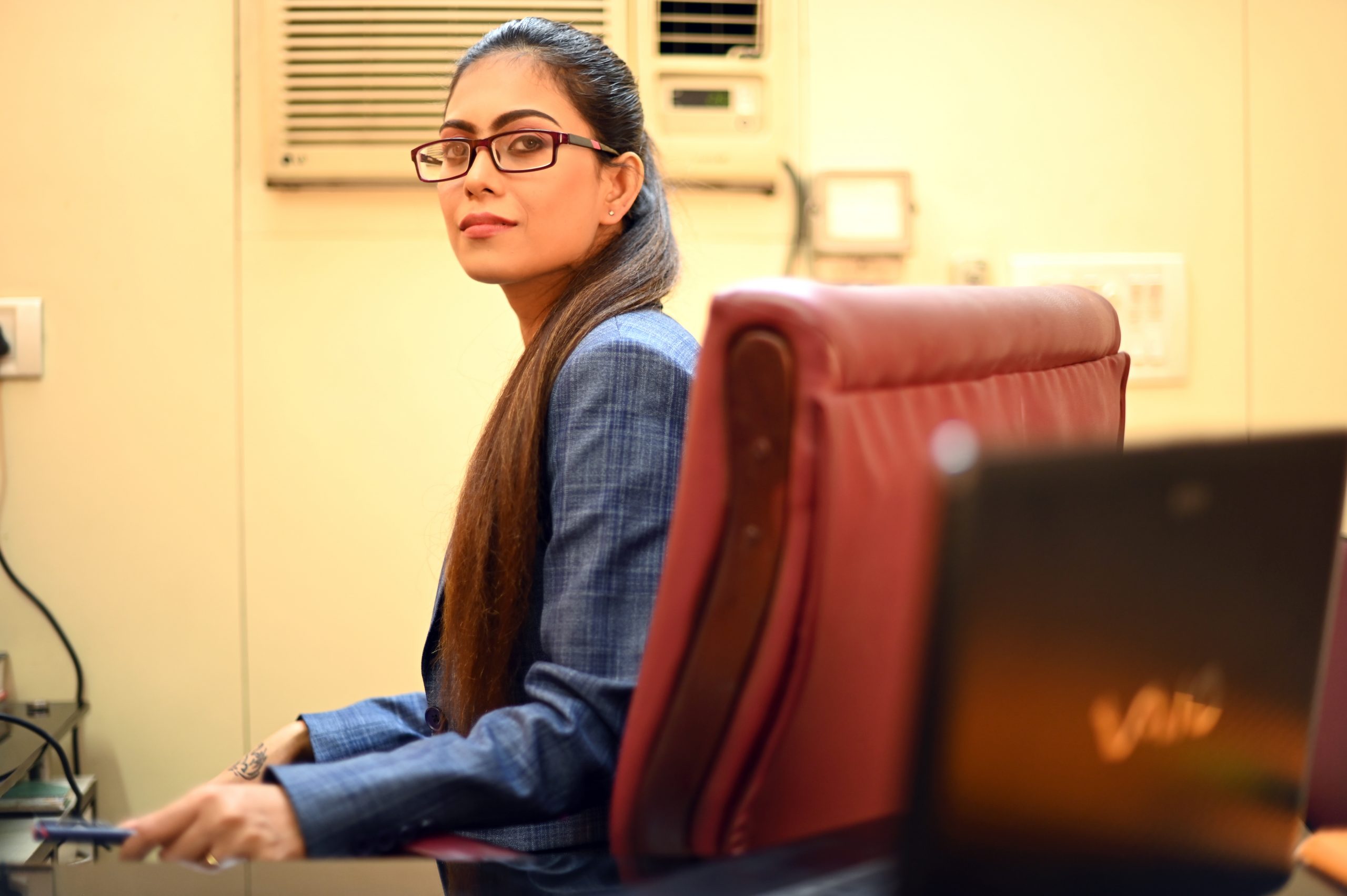 Women sitting on a chair in office