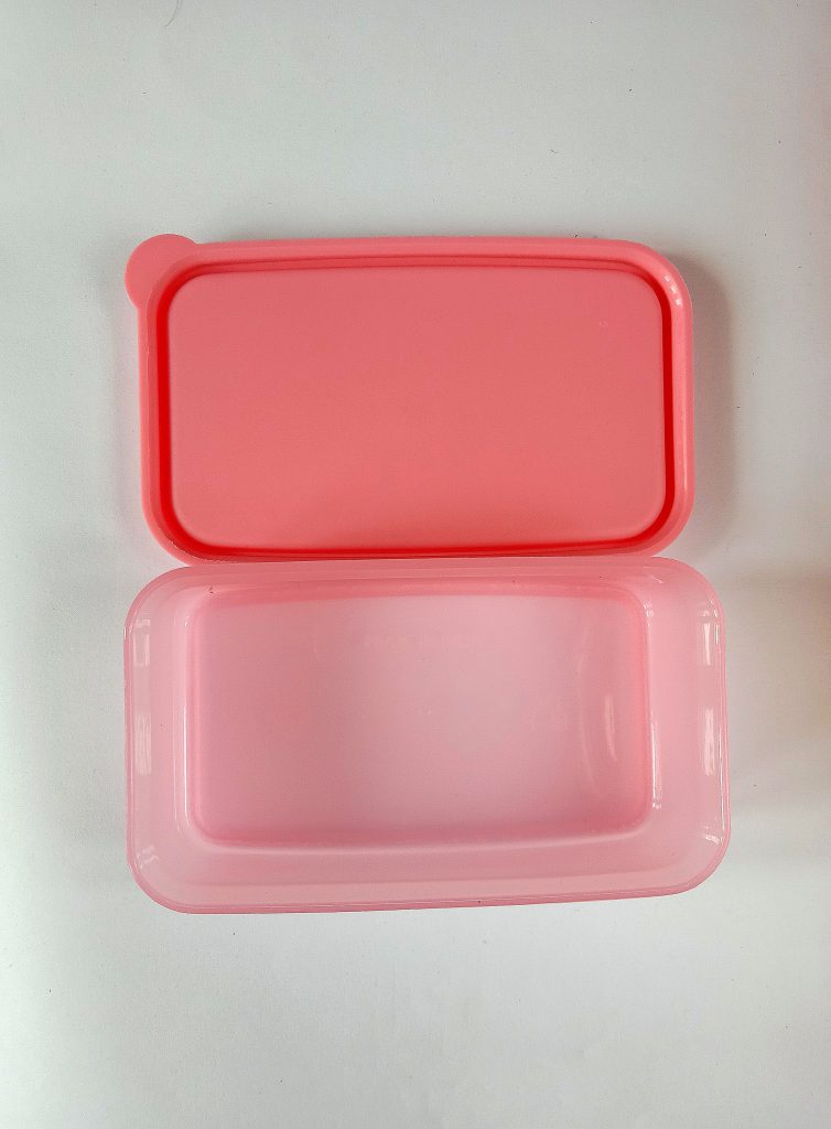 Reading, United Kingdom - February 03 2018: A small tupperware box with a  pink lid Stock Photo - Alamy