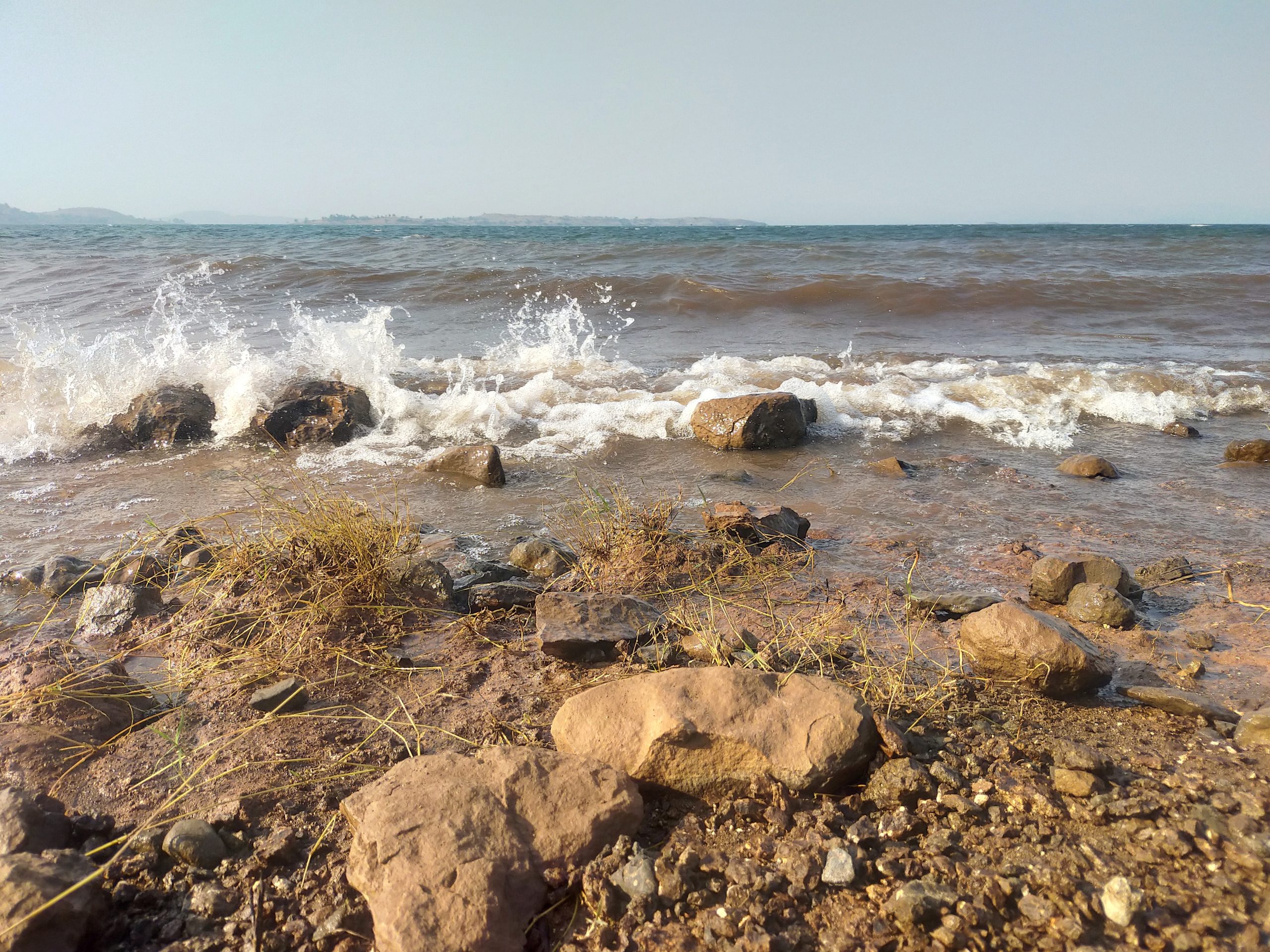 sea waves splashing on the rocks