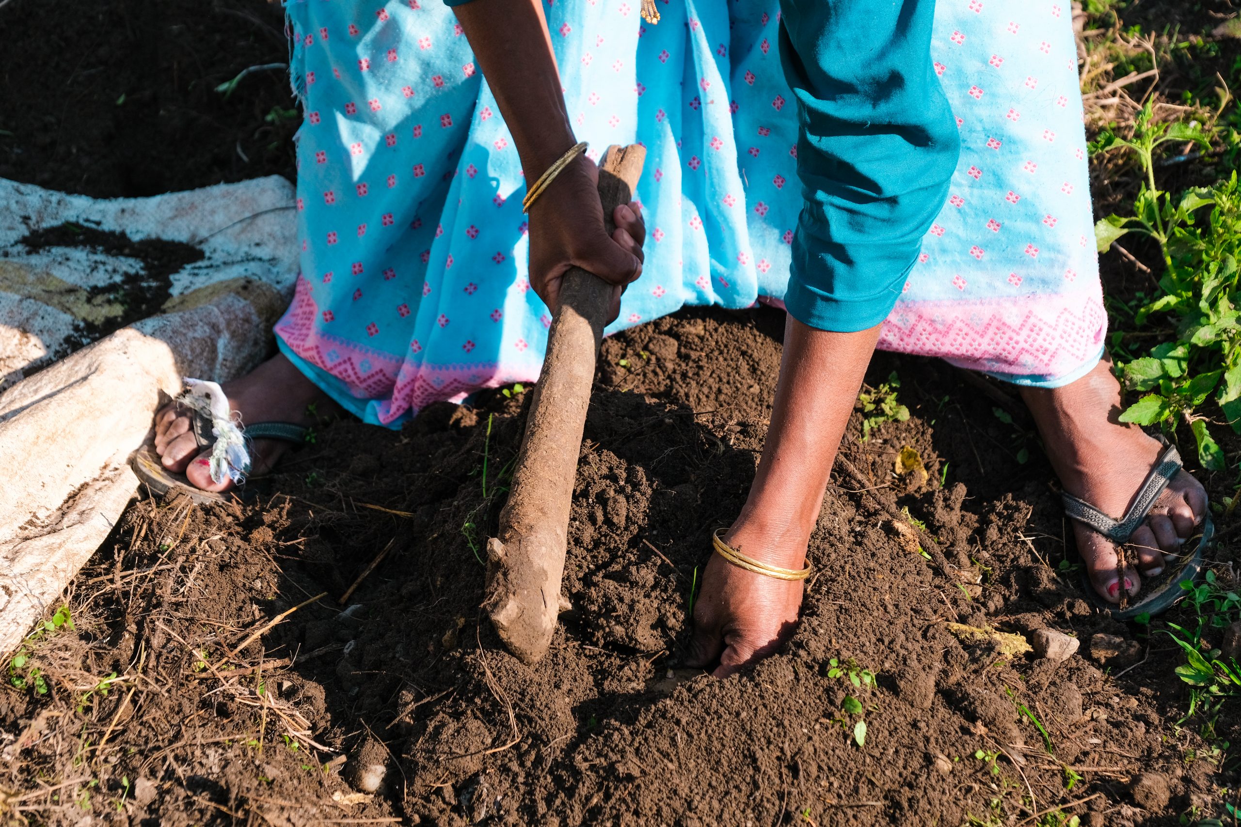 A farmer working on soil