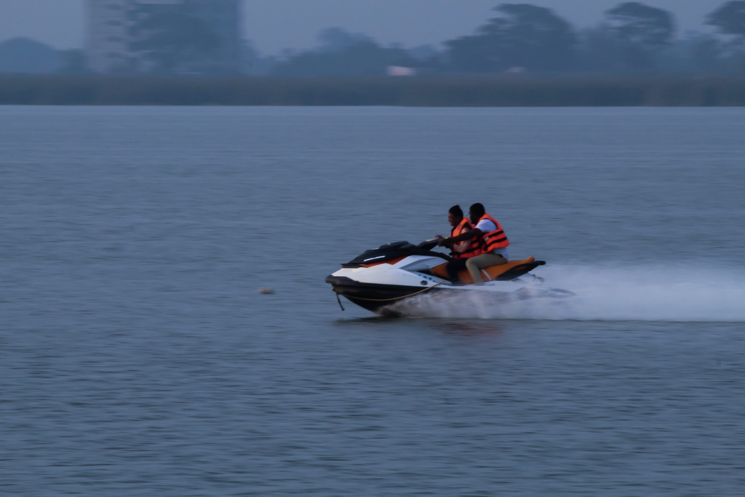 Men driving a speed boat