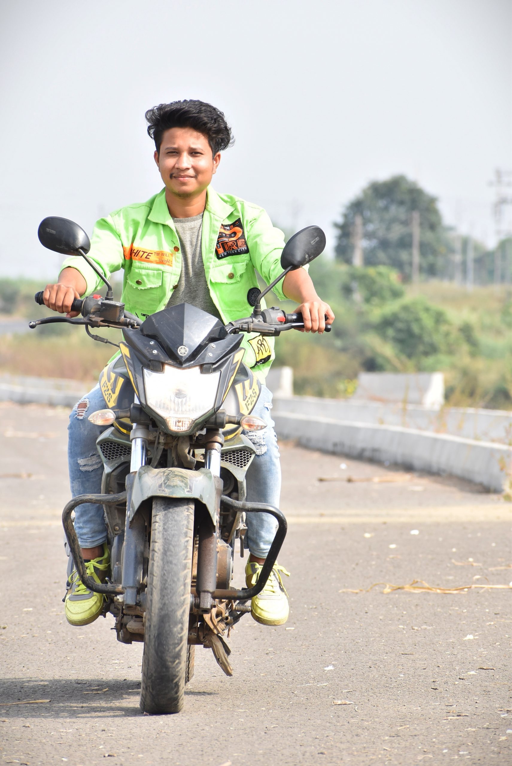A boy on a motocycle