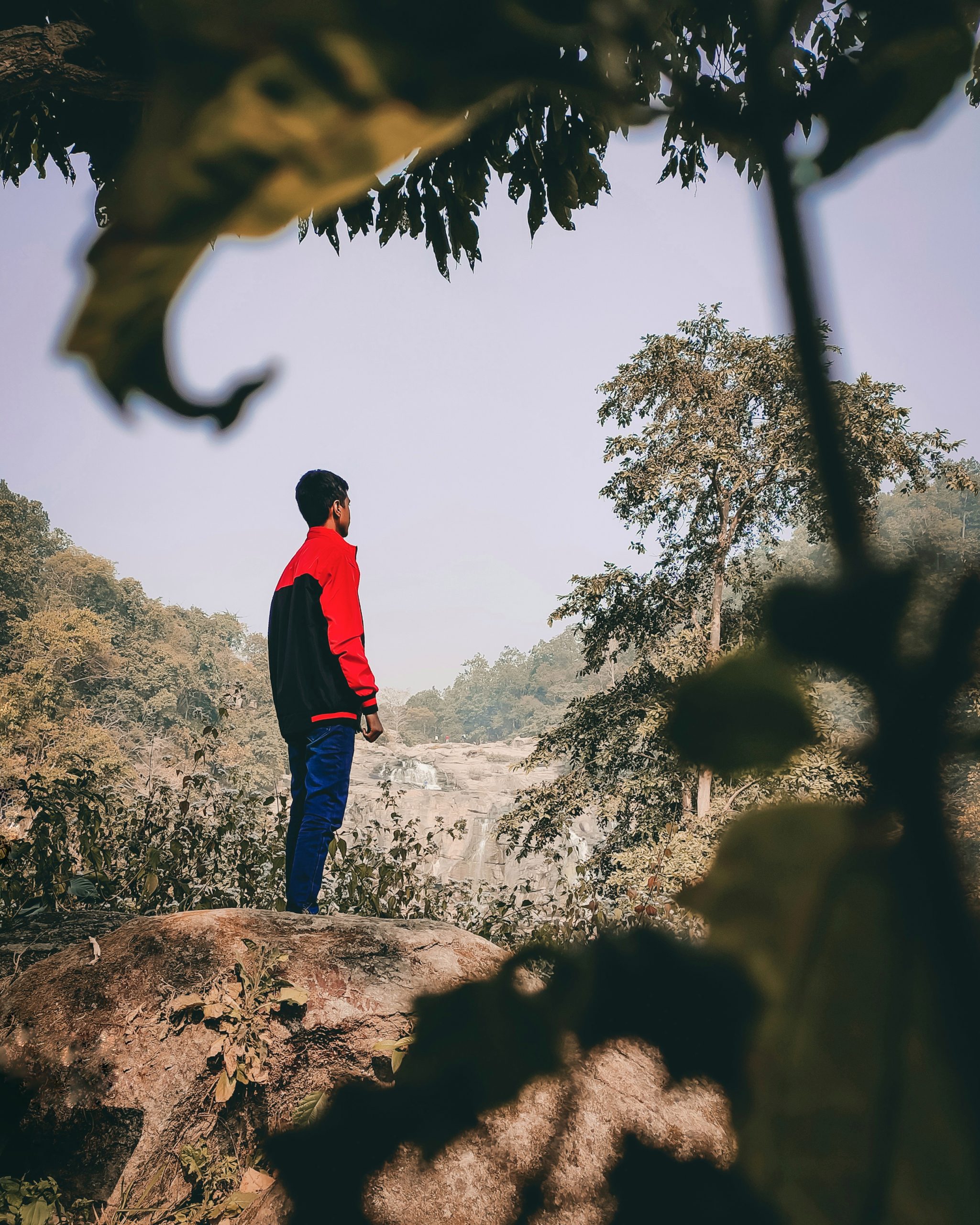 A boy posing on rock