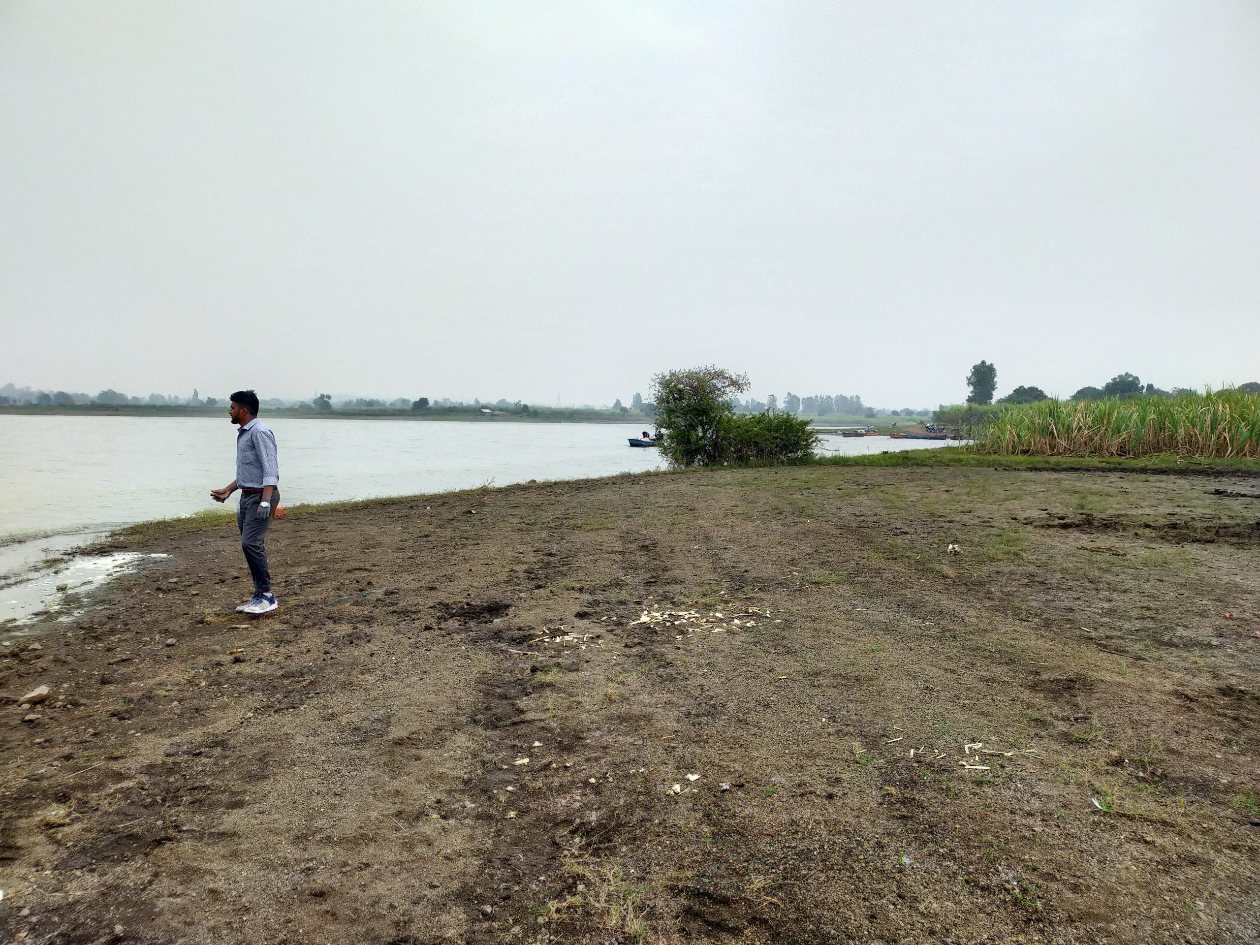 Boy beside the river