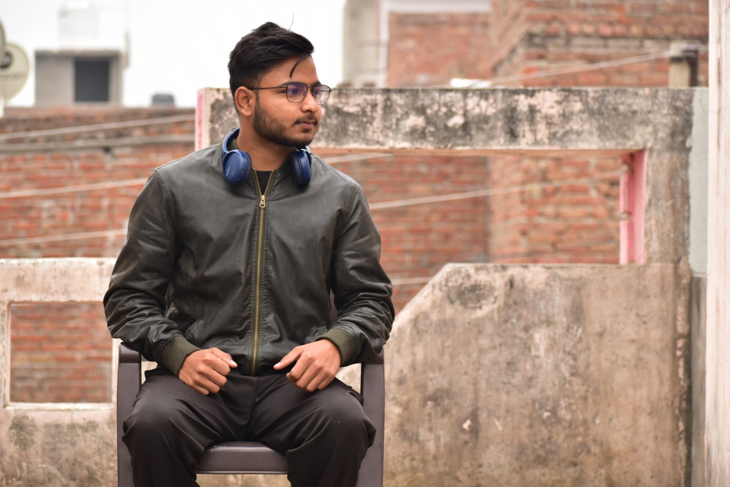 Boy posing while sitting